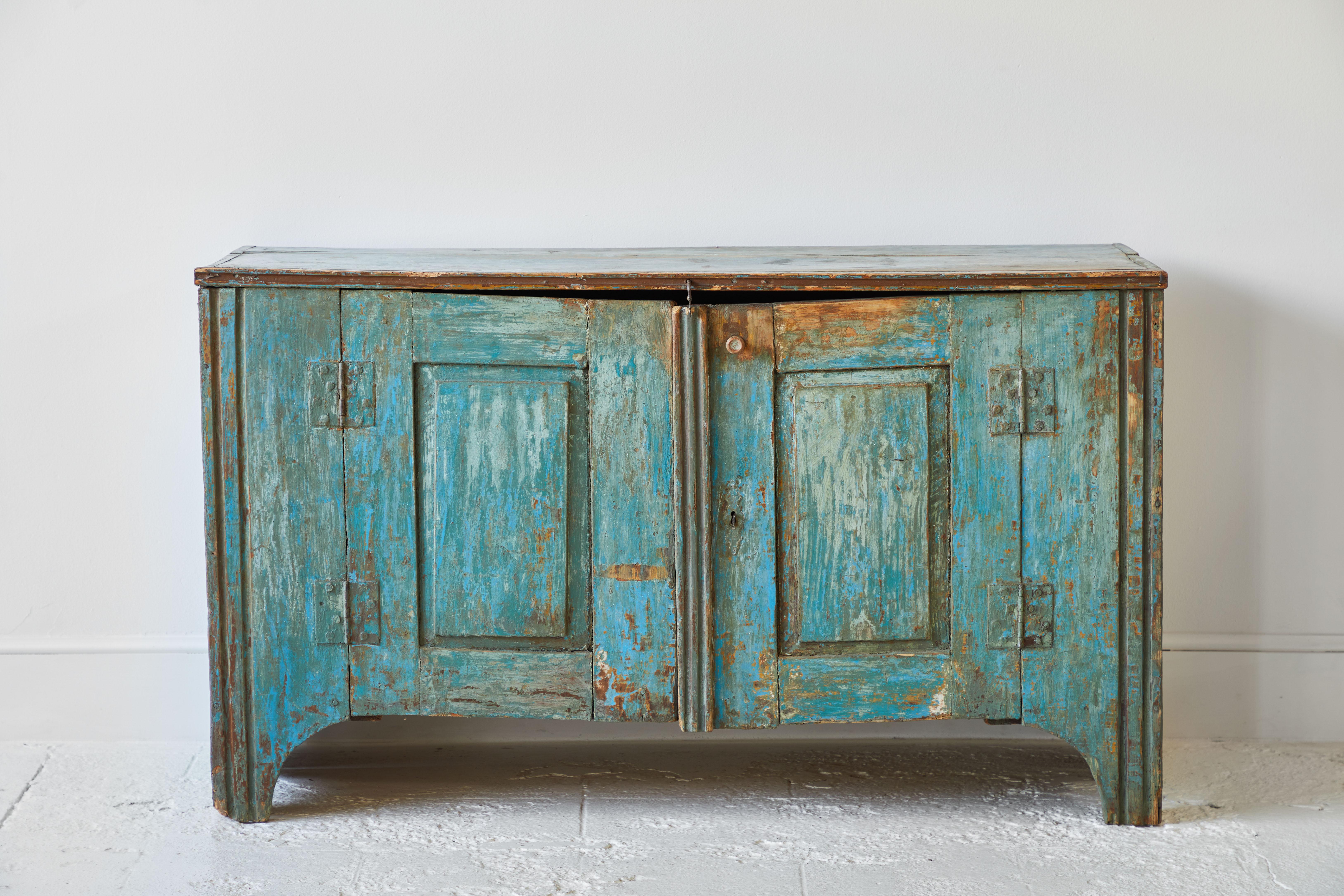 Mexican rustic blue two-door buffet, the piece is whimsically aged.
