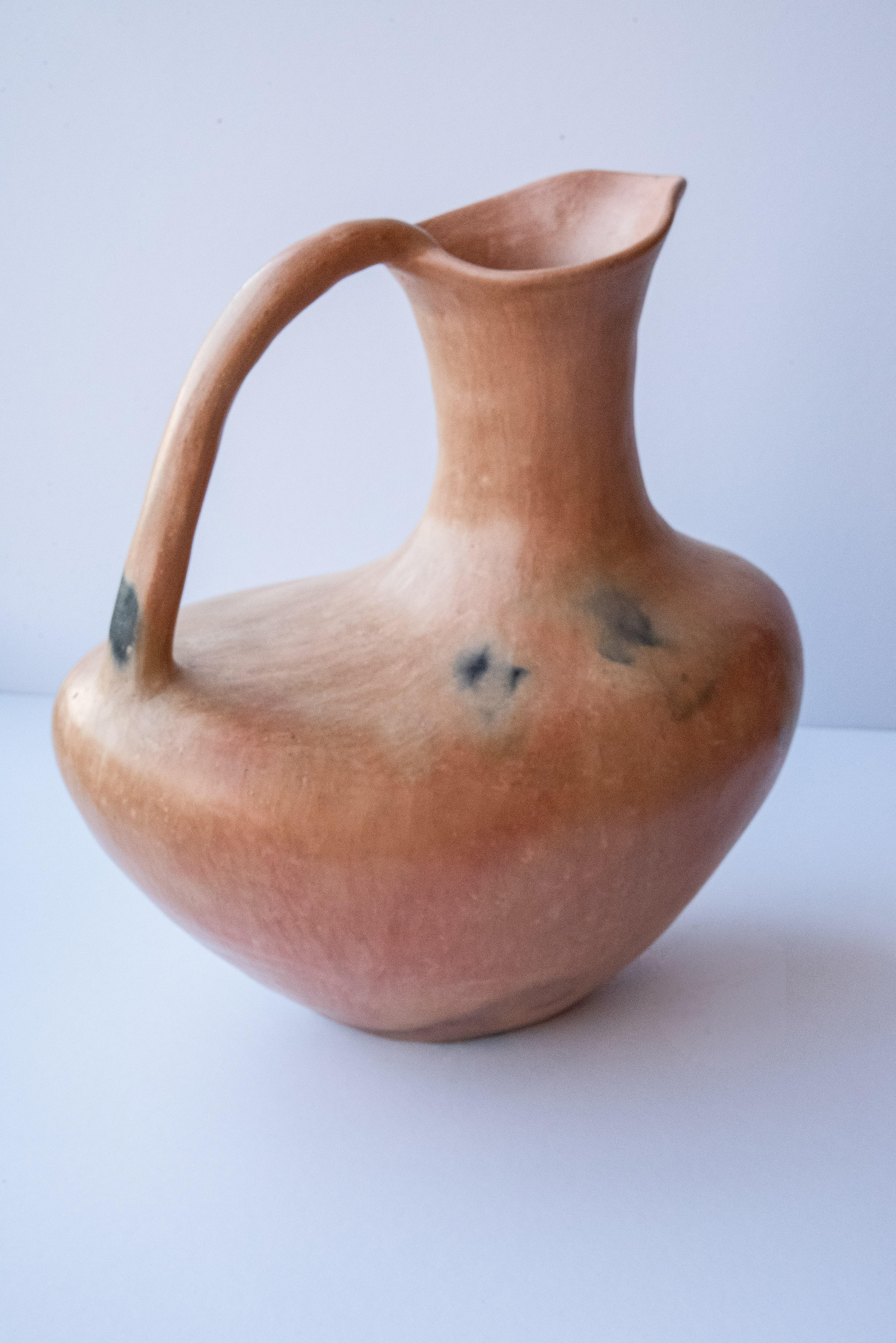 Rustic water vessel made in natural clay from the Mixe Region in Mexico. 

In the heart of the Sierra Norte Mountains in the state of Oaxaca, Mexico, the settlers found that this 
