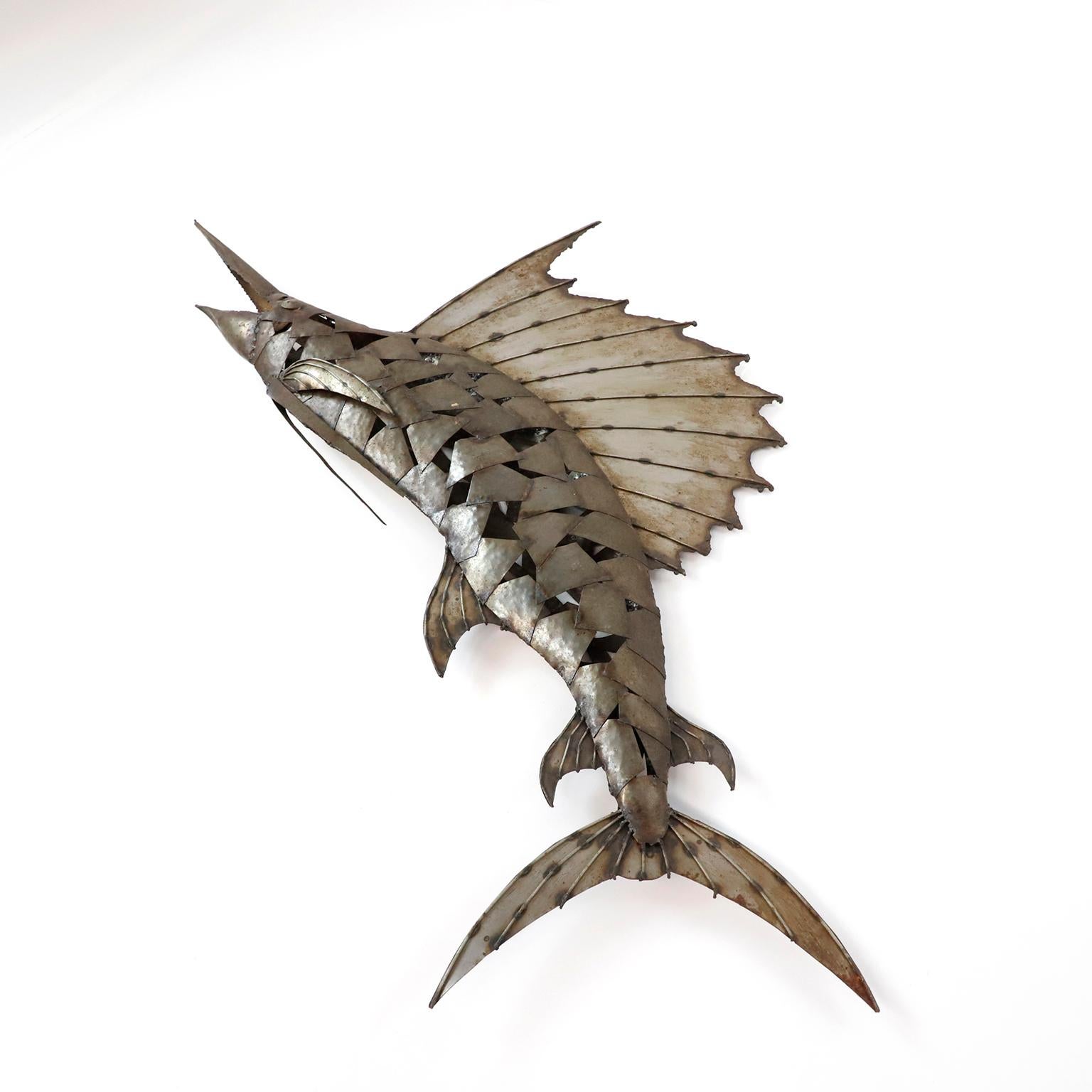 Circa 1980, we offer this Mexican Sailfish handmade in iron with fantastic patina.