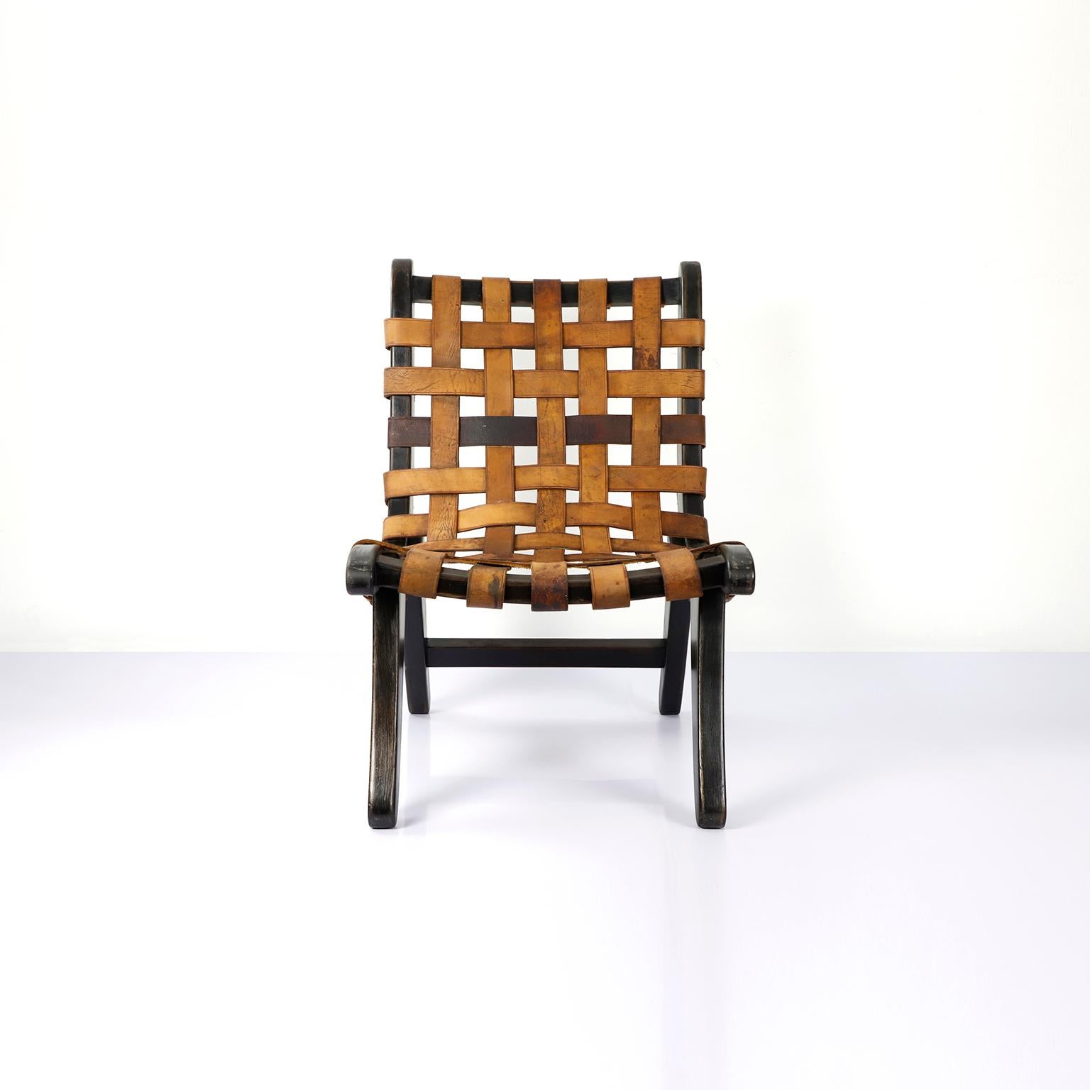 We offer this Mexican San Miguelito chair attributed to Michael Van Beuren, circa 1950 in primavera wood and leather ribbons.