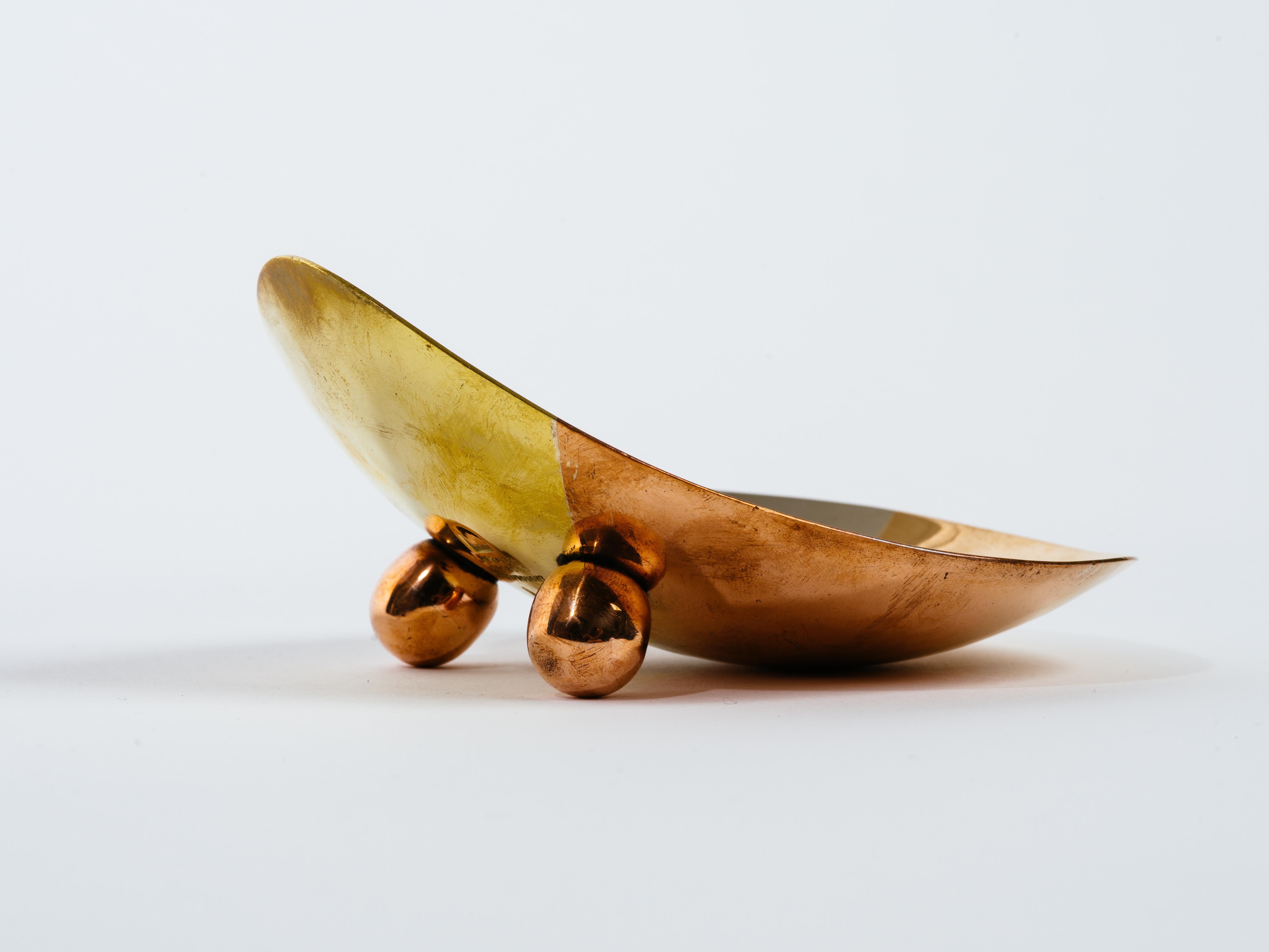 Silver, copper and brass curved tray with brass ball feet, by Los Castillo,
 Taxco, Mexico. Stamped on bottom Metales Casados hand-wrought A 7.