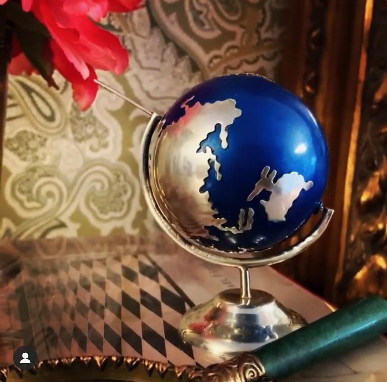 A wonderful desk accessory, a spinning Mexican sterling silver and enamel globe... as the world turns a rattler makes a noise similar to that of an Asian silver ball.