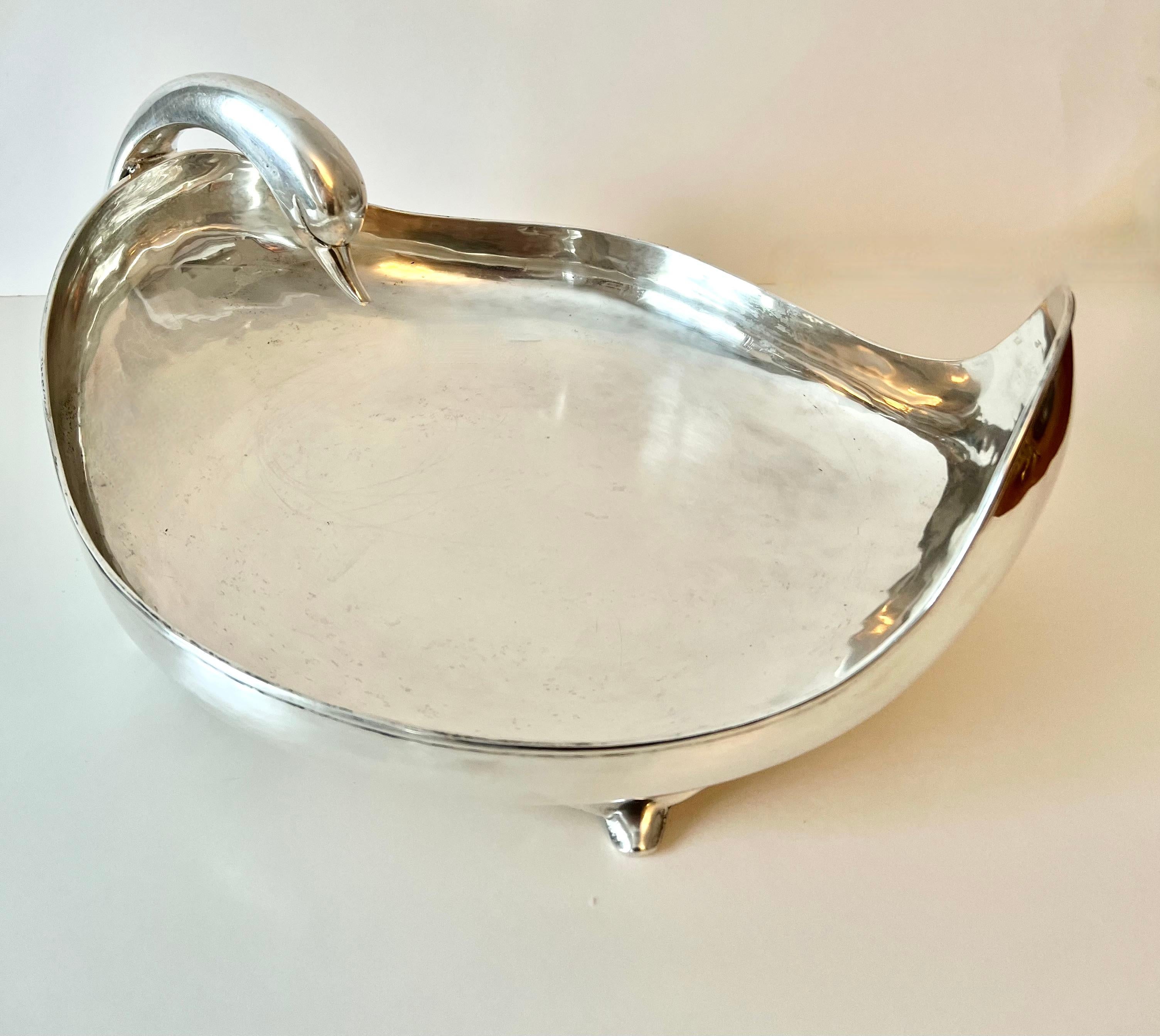 C. Zurita signed Mexican Sterling Silver Centerpiece or bowl in the shape of a swan, gracefully looking back over its body. A stunning piece made of 31.5 Ounces of Sterling, the shape and design are special.

A compliment to any cocktail table,