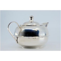 Mexican-style smooth silver pot with a rounded shape