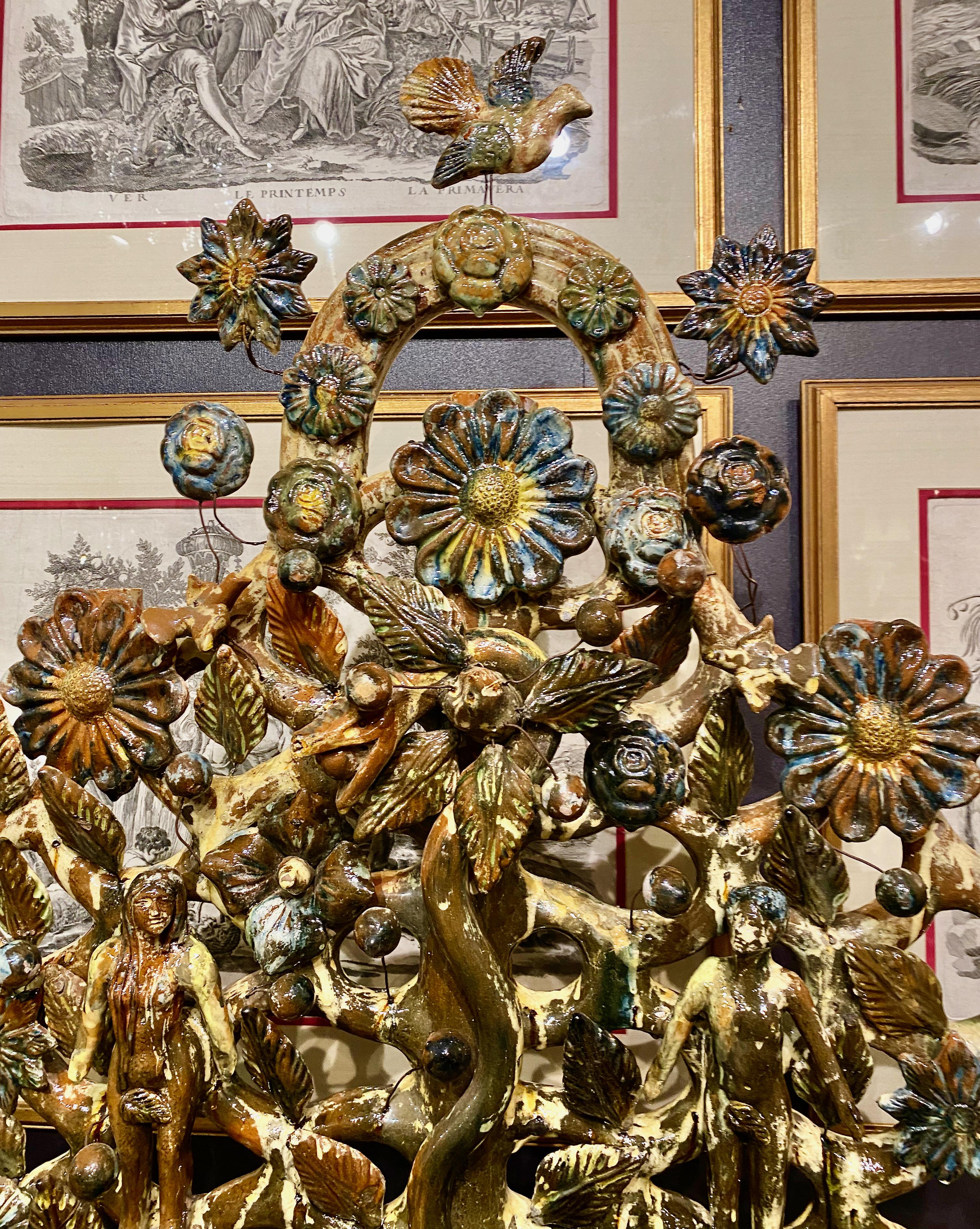 This is a very large (42 inch high) Mexican Adam and Eve Tree of Life Sculpture that is firmly attributed to Alfonso Soteno Fernandez and created in his earlier phase. A similar example, but considerably smaller is exhibited by The British Museum.