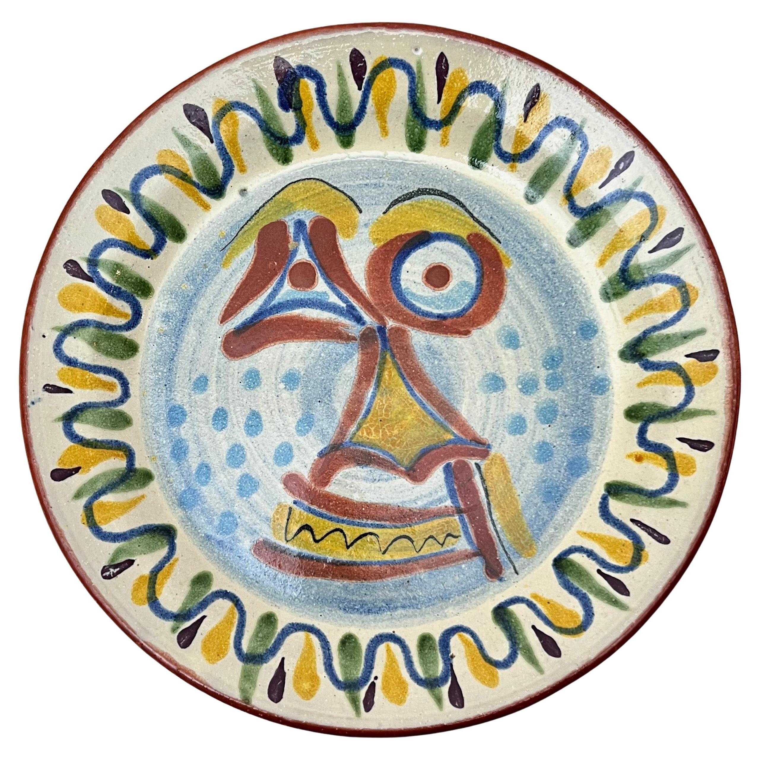 Unique and a rare find are these fabulous Mexican wall face plates in the style of Picasso.  Lots of graphic whimsy in each hand painted plate which is signed on the back.  No doubt these are great faces that can adorn any room in the house from