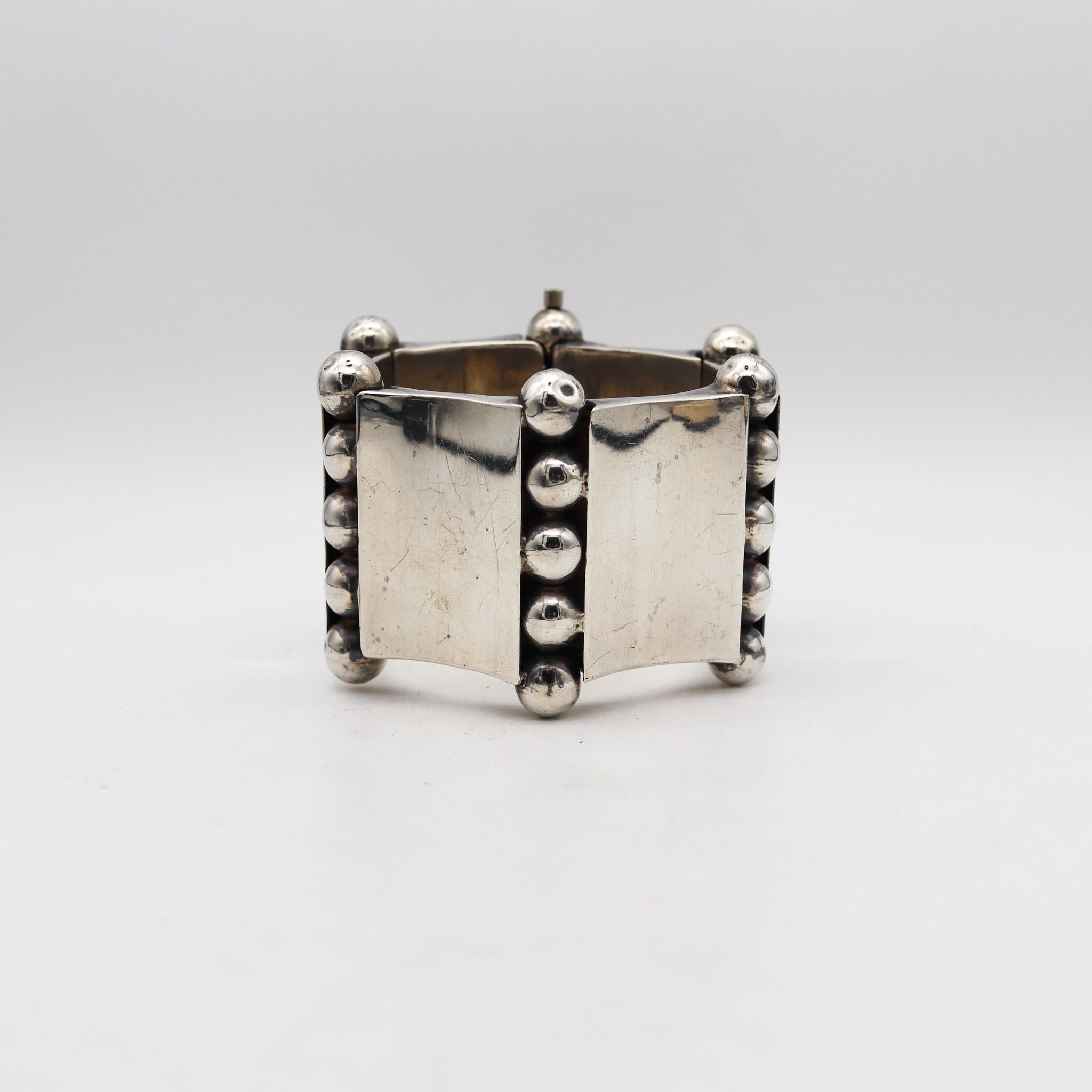 Statement bracelet in the manner of William Spratling.

Beautiful and bold bracelet, created in Taxco Mexico during the mid-century period, back in the 1950. Crafted in solid .925/.999 sterling silver with high polished finish. Designed by a
