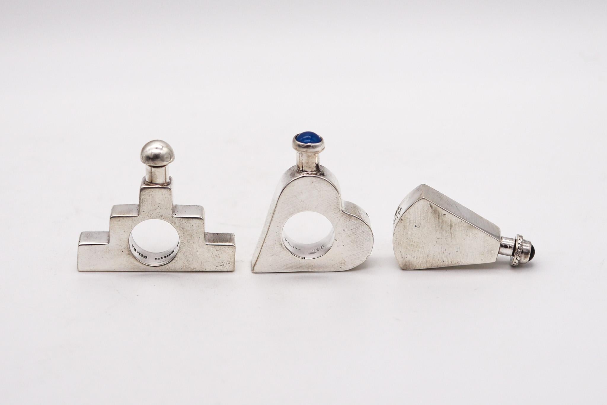 A group of retro modern perfume bottles in sterling silver.

Beautiful set of three perfume scent bottles, created in Taxco Mexico back in the 1970. They are very decorative bottles and one of a kind pieces, crafted with retro-modernist and