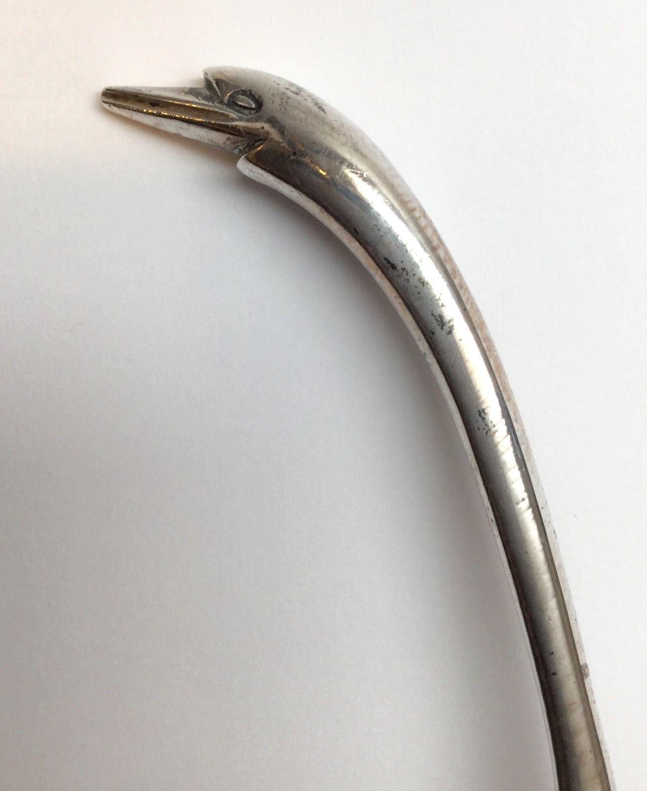 Mexico Sterling silver duck head handle drizzle spoon. 
Marked: Eagle 9, 925, Mexico STERLING. 
Measures: 8