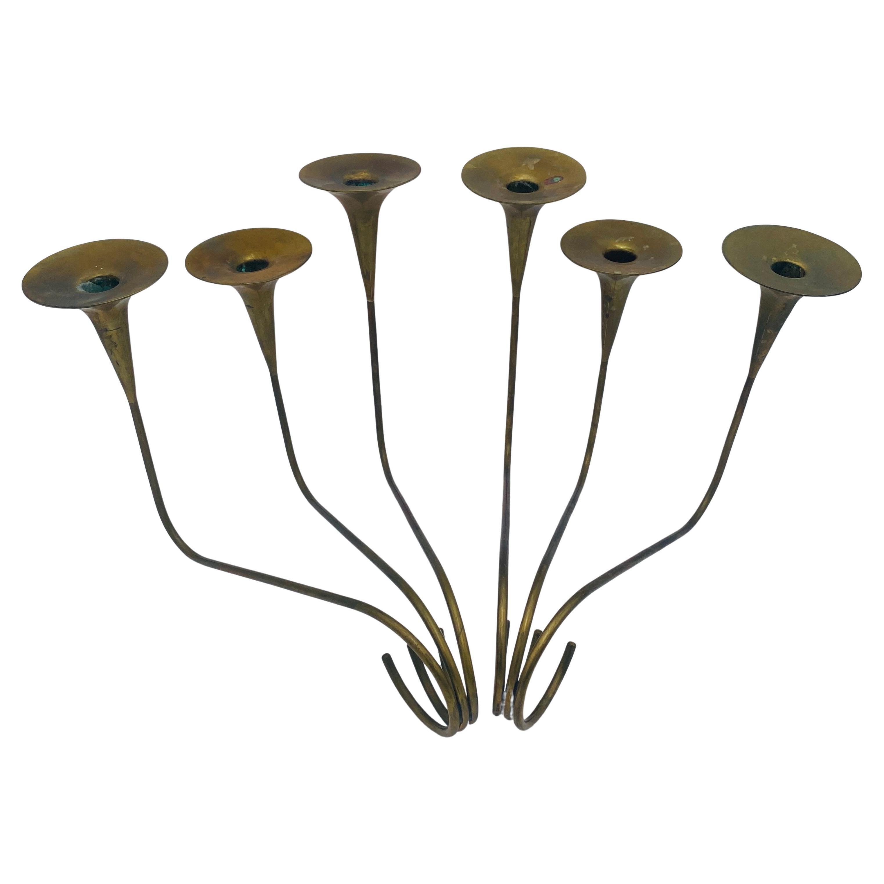This is a pair of 2 brass candleholders handmade in Laton, Mexico. Each modernist candleholder has 3 sculptural candlesticks. They are stamped 