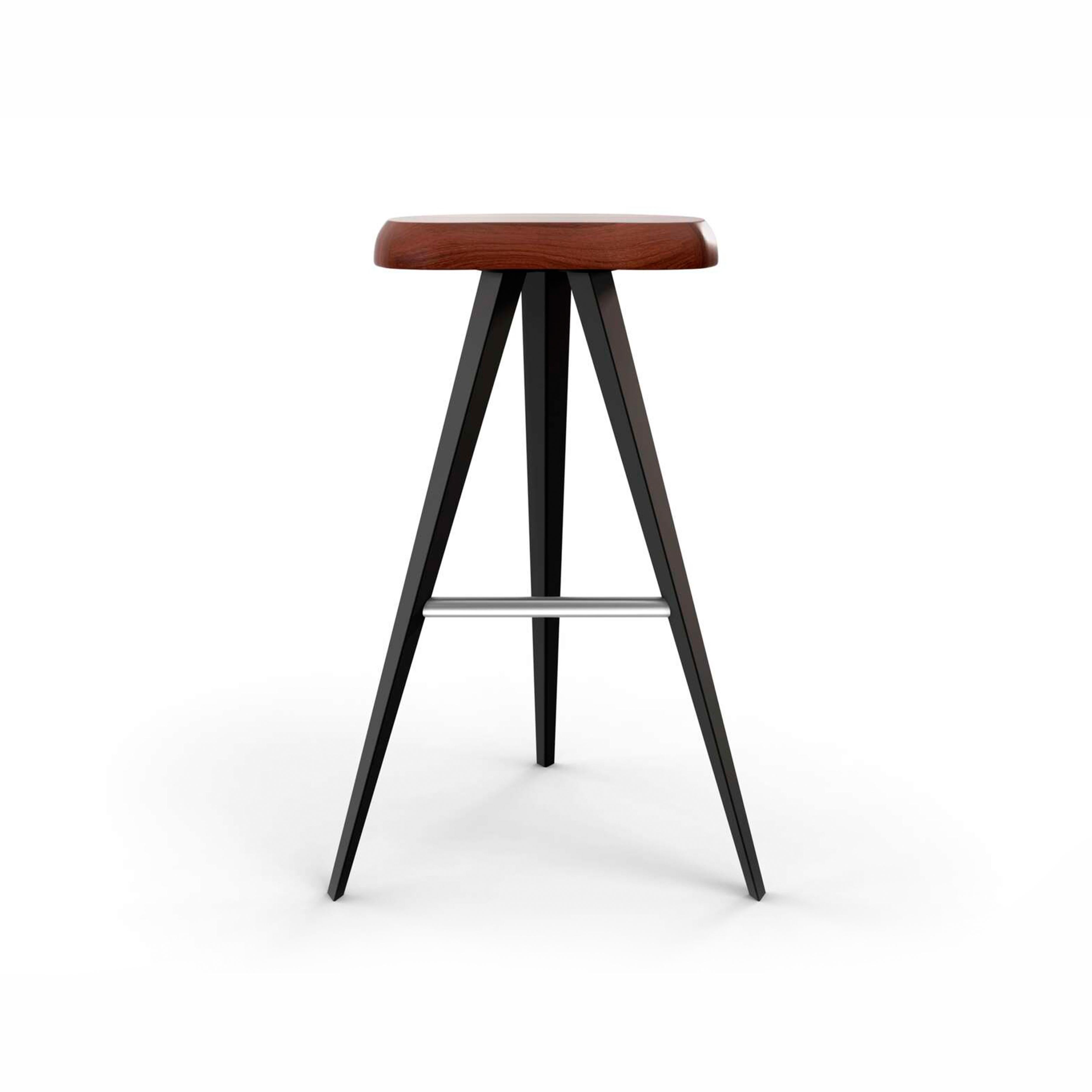This stool in the Mexique family, measures 72 cm high. The free-form chair, in solid wood, is set off beautifully by the lightness of the geometric structure of the metal legs with matte black or glossy gunmetal painted finish.

This designer stool