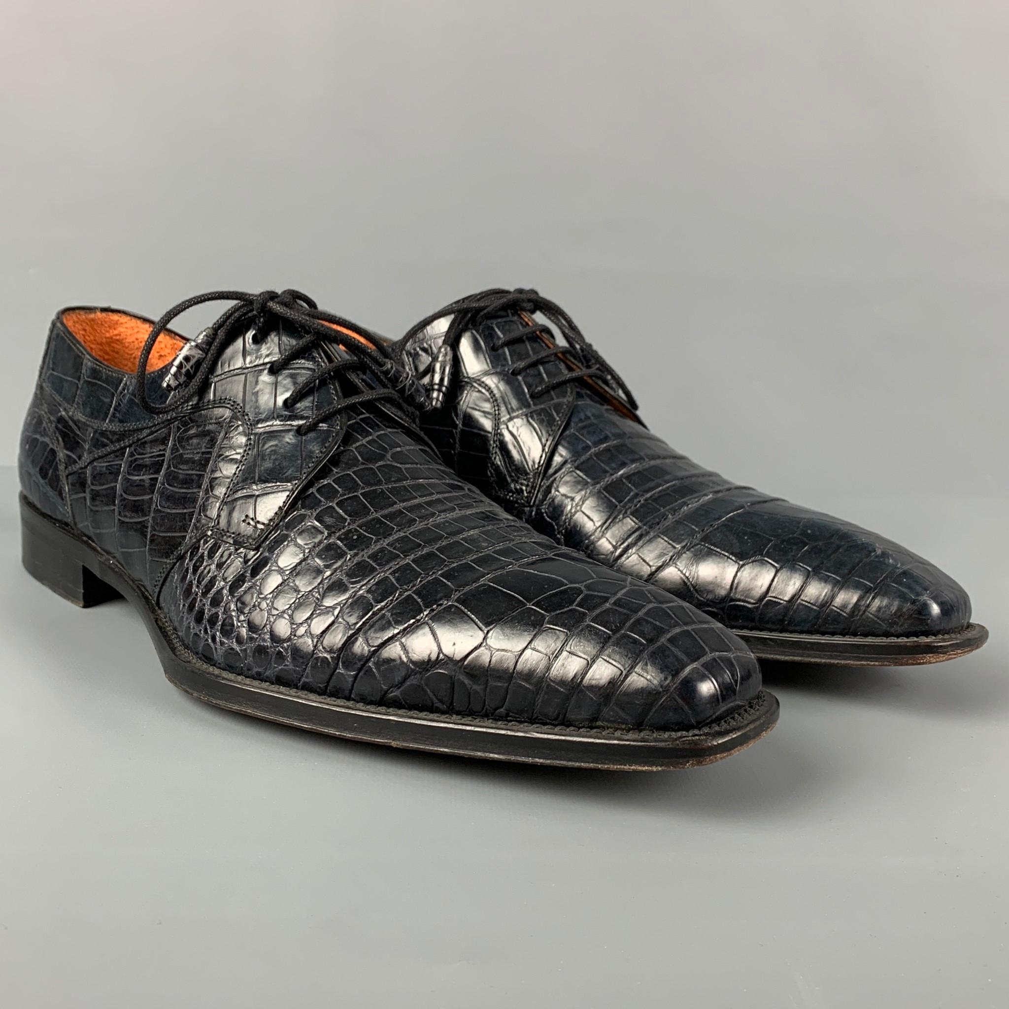 MEZLAN shoes comes in a blue textured alligator leather featuring a square toe and a lace up closure. Made in Spain. 

Very Good Pre-Owned Condition.
Marked: 9.5 M
Original Retail Price: $1,495.00

Outsole: 12.5 in. x 4.5 in. 