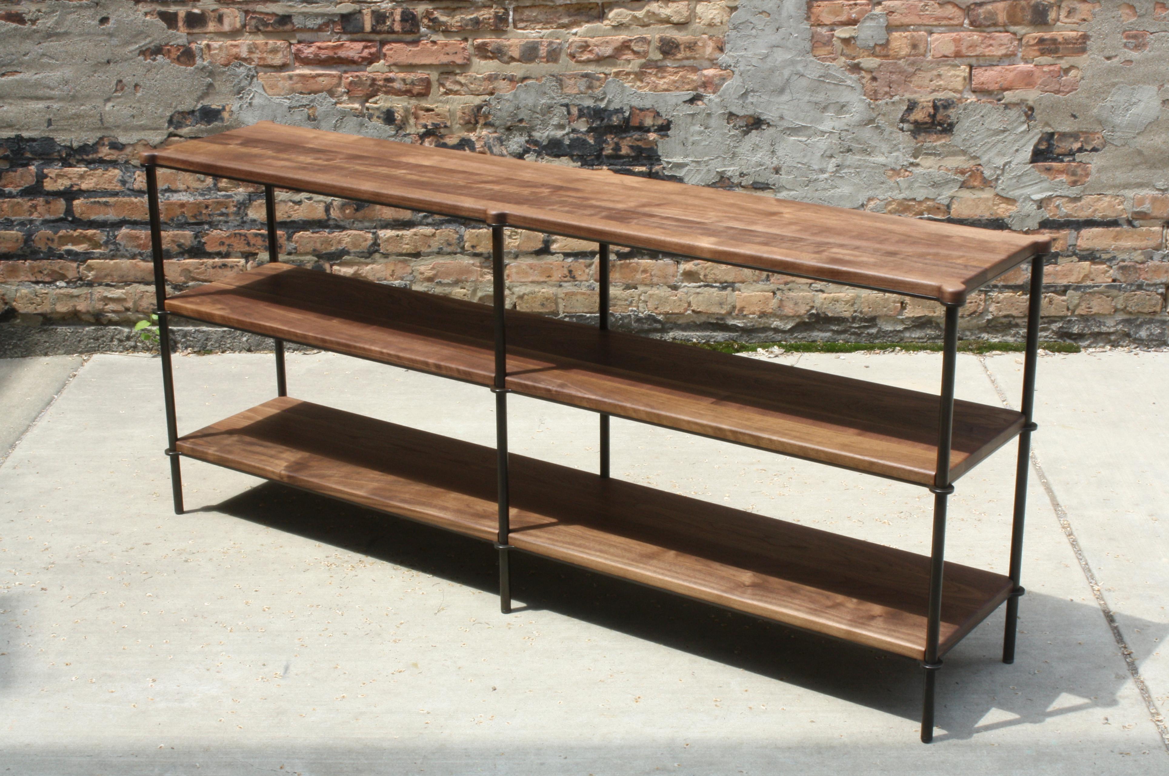 Shown in acid blackened steel with solid walnut shelving
Measures: 66