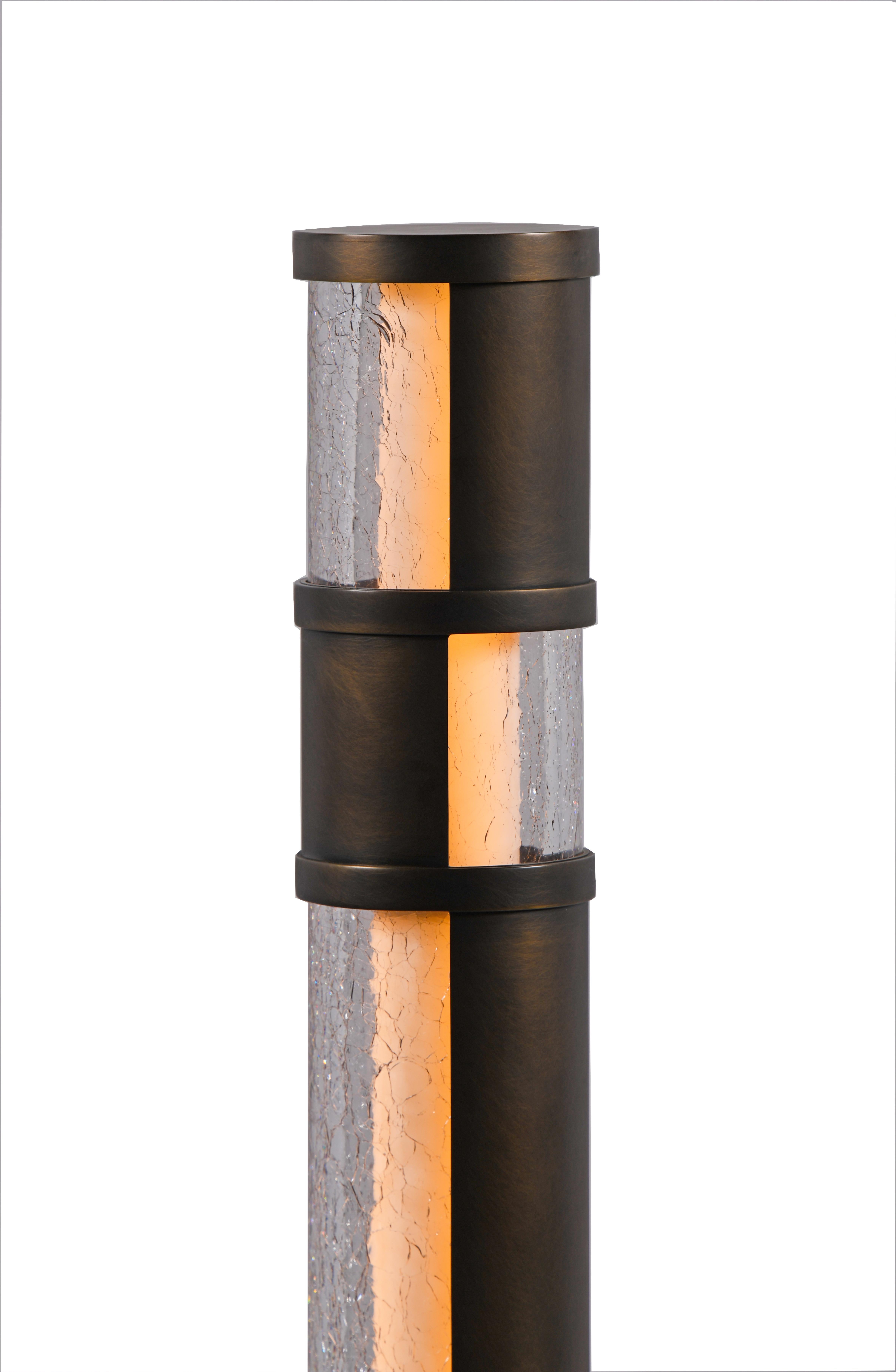 A Mondrian-inspired composition of glowing cristale crackle glass and warm antique brass creates an architectural column as a or torchiere. Custom Sizes Available.


Models in the collection are individually hand-crafted by the skilled artisans in