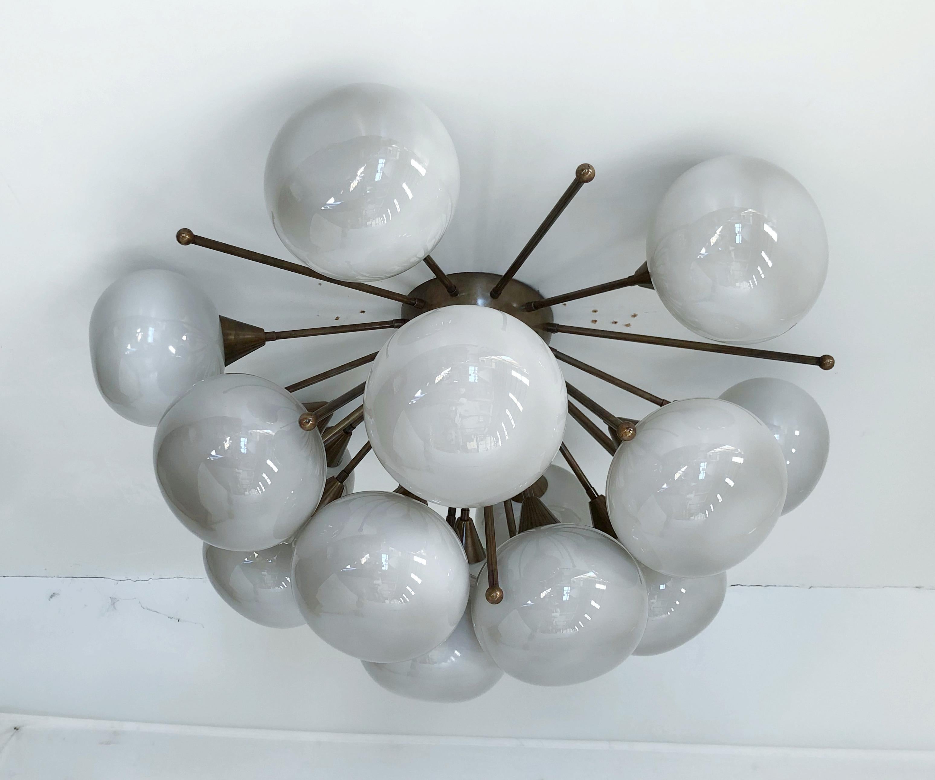 Italian sputnik flush mount with gray Murano pebble glass shades mounted on solid brass frame
Designed by Fabio Bergomi / Made in Italy
15 lights / E12 or E14 type / max 40W each
Diameter: 35.5 inches / Height: 18 inches
Order Only / This item ships