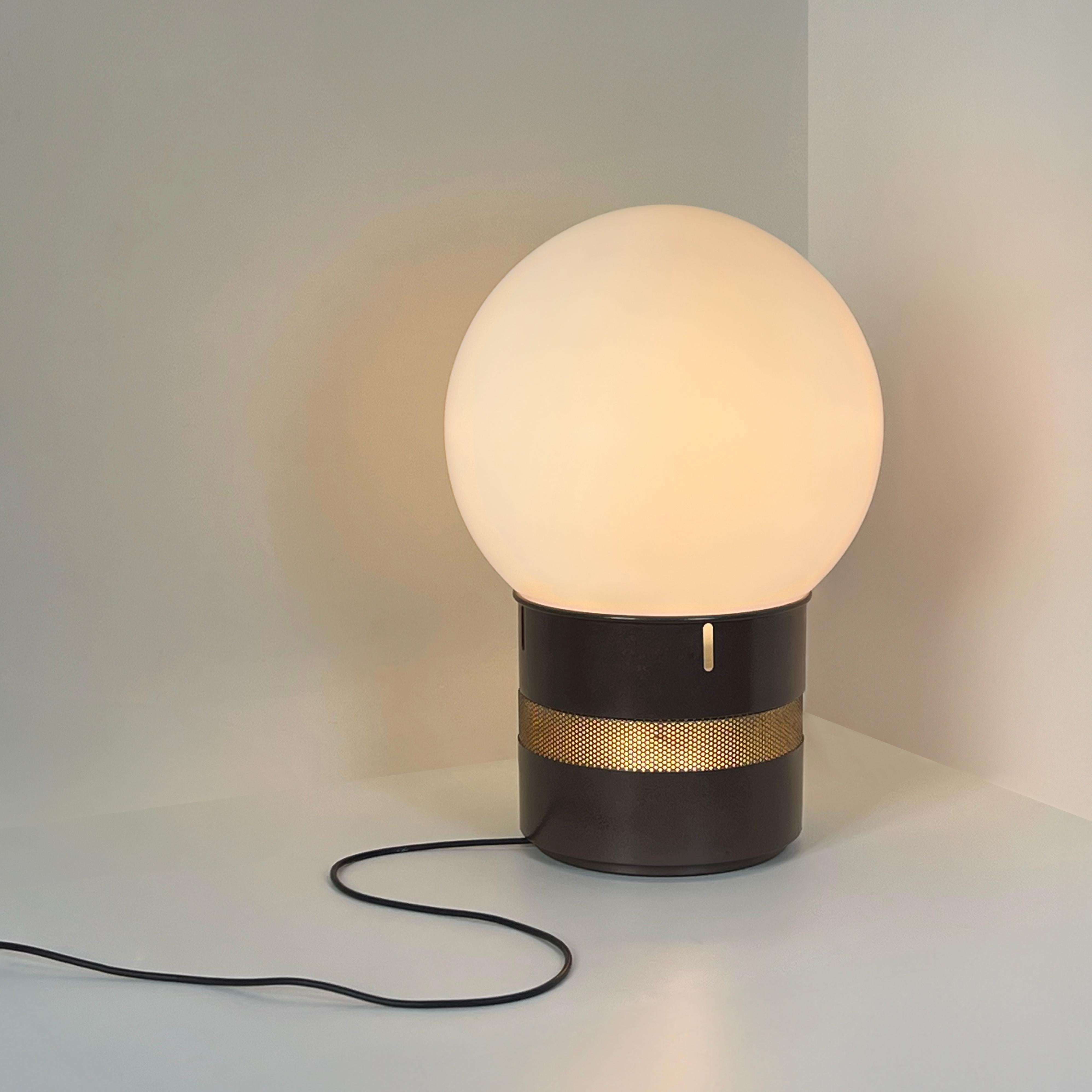 The Mezzo Oracolo lamp, a masterpiece of design by Gae Aulenti for Artemide in the 1970s, is a stunning embodiment of clean lines and timeless elegance.

At its core, this lamp is defined by a captivating glass sphere, reminiscent of an oracle's
