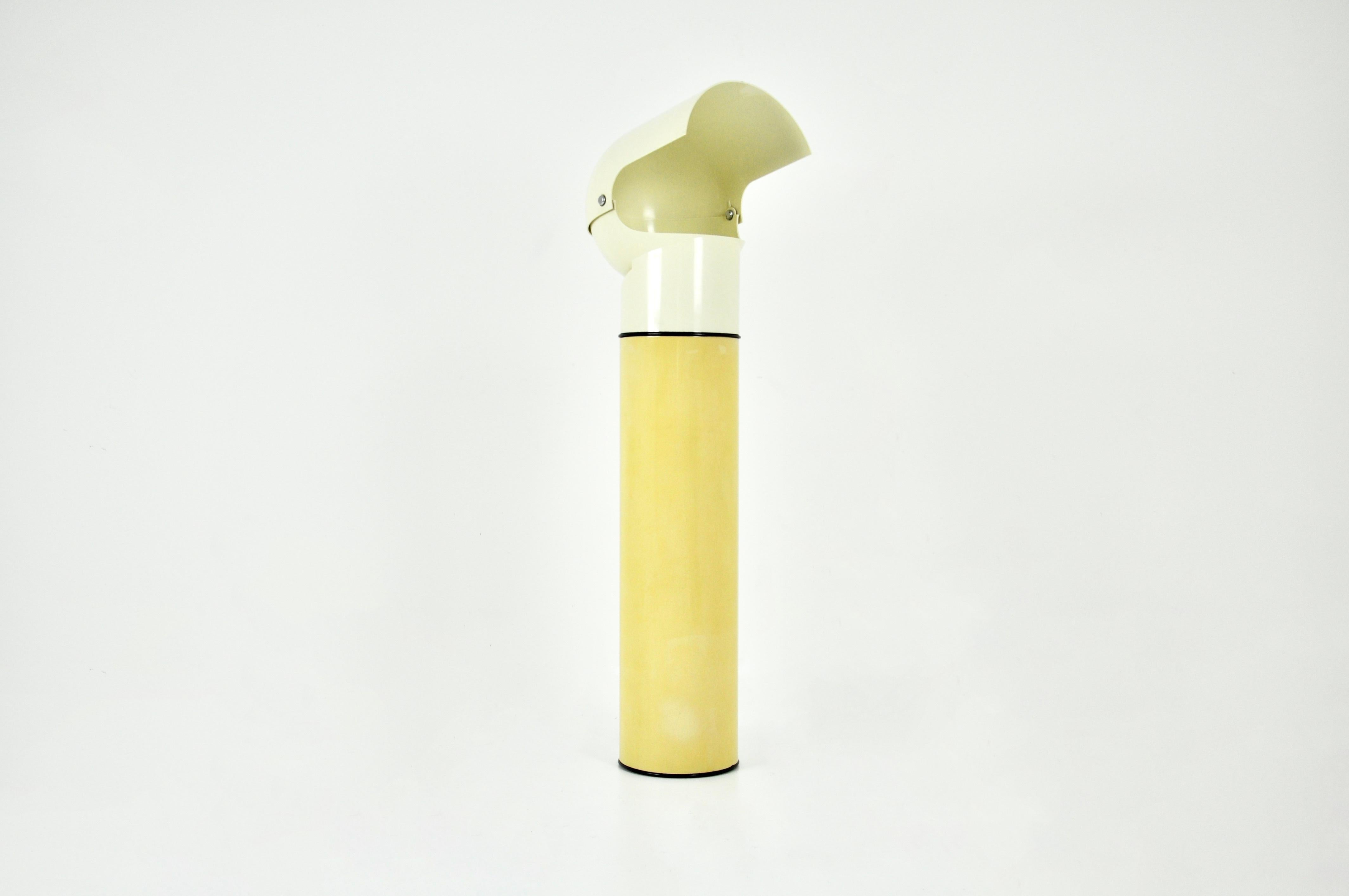 Rare plastic and metal floor lamp designed by Gae Aulenti. Stamped on the underside. The adjustable shade allows light to be directed in different directions. The base and intermediate joint of the lamp have been replaced (as the old one cracked).