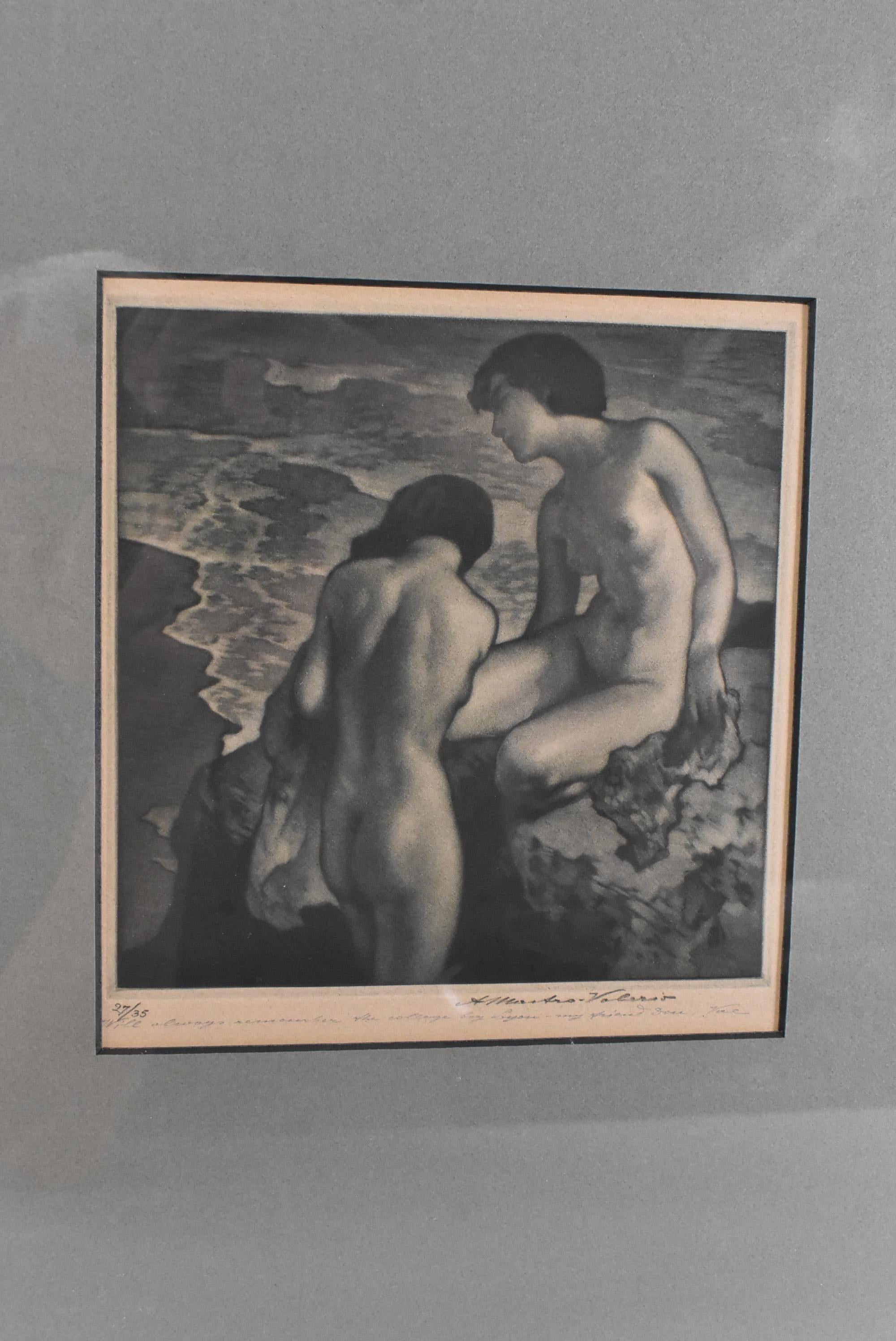 Mezzotint two nudes on the seashore lounging on a rock by Alessandro - Mastro Valerio 1887-1953. Signed lower right. Number 27/35. Hinged to backerboard. Very good condition. Light discoloration to paper from age. Frame has some wear.  Image 7 1/2