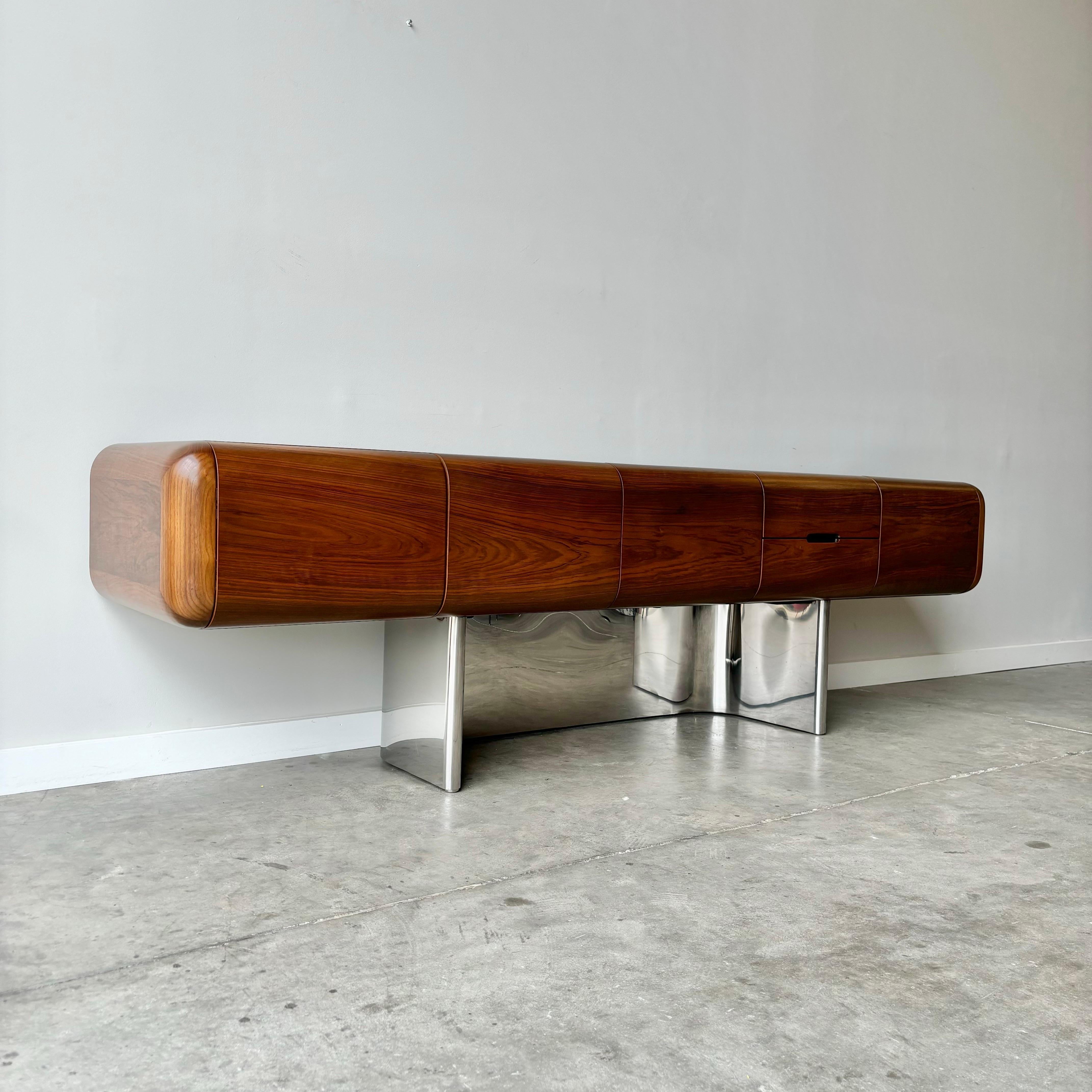 A rare and fine example from Stow Davis.  The 'Tomorrow' Collection features organic flowing steel bases in a seating group, credenza, and desk.  These pieces are becoming harder to find and exceedingly desirable.  This walnut cased credenza has