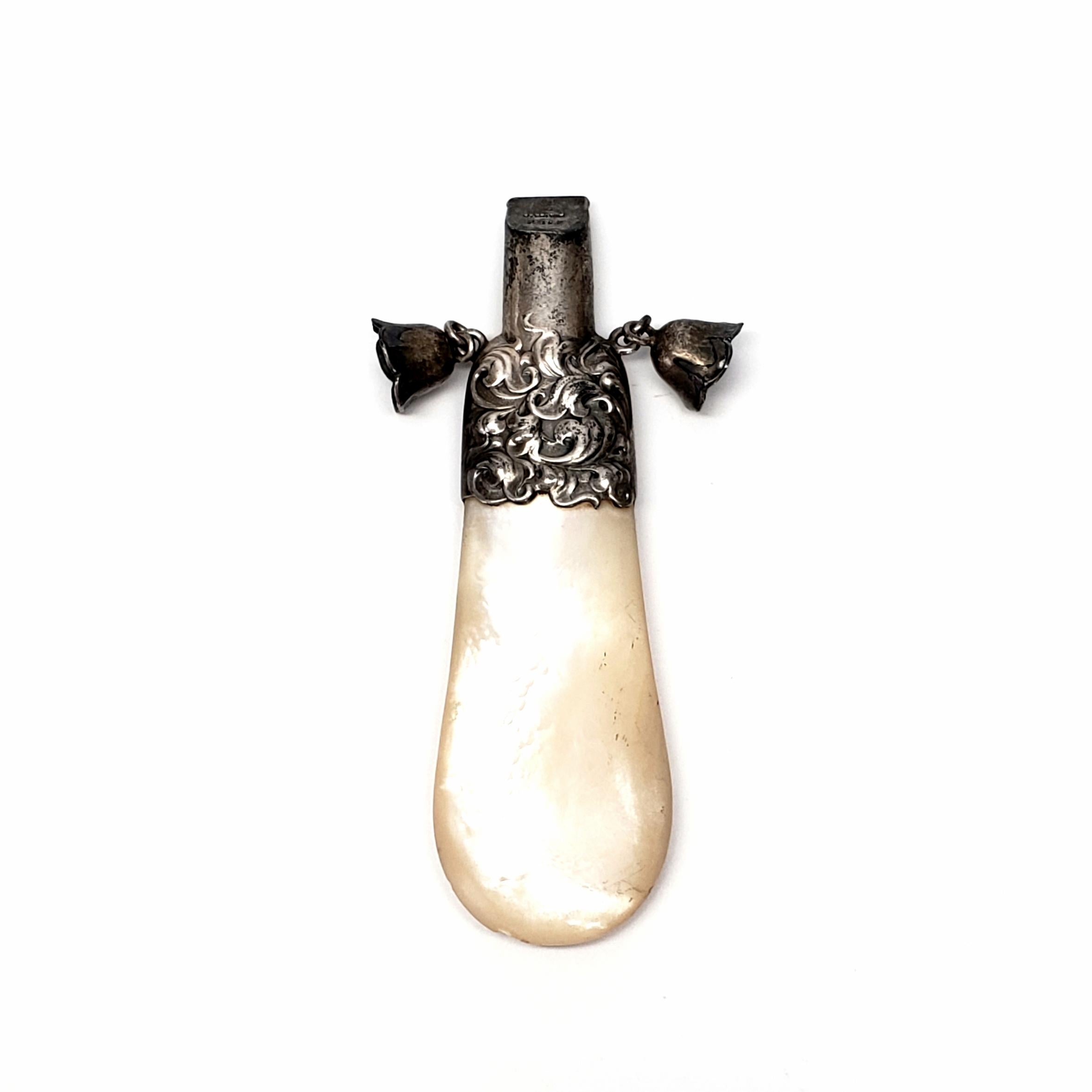 Vintage sterling silver and mother of pearl baby whistle and rattle by Whiting Manufacturing Co.

Beautiful piece from Whiting Manufacturing Co of NY, NY featuring a large piece of mother of pearl topped with a sterling silver whistle and two