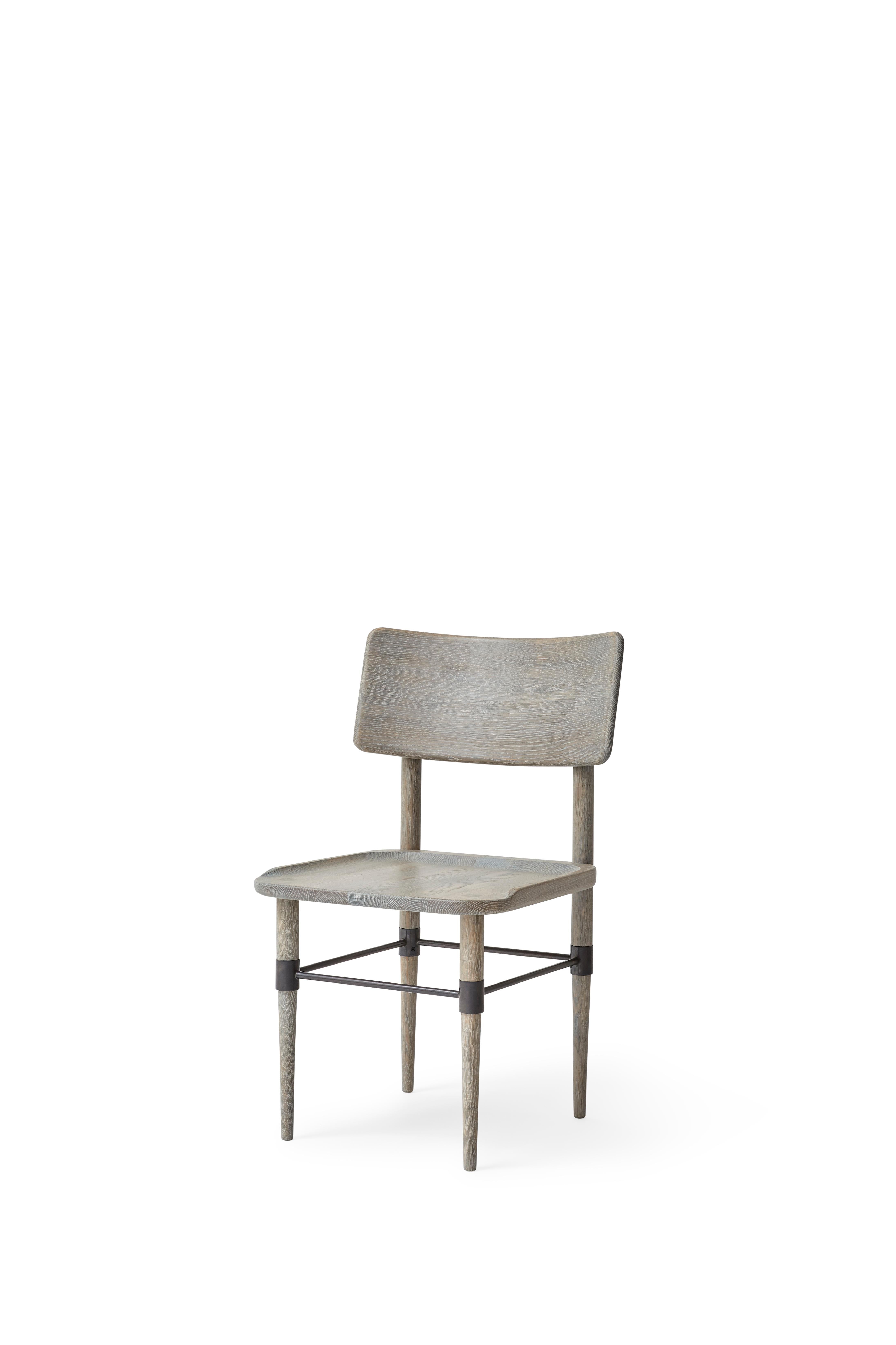 MG101 Dining chair in Grey Nature oak and blackened metal. The seat pad is not included and can be ordered separately.

The Holmen series originates in a series of furniture, which was developed for Michelin restaurant 108 in Copenhagen. The common