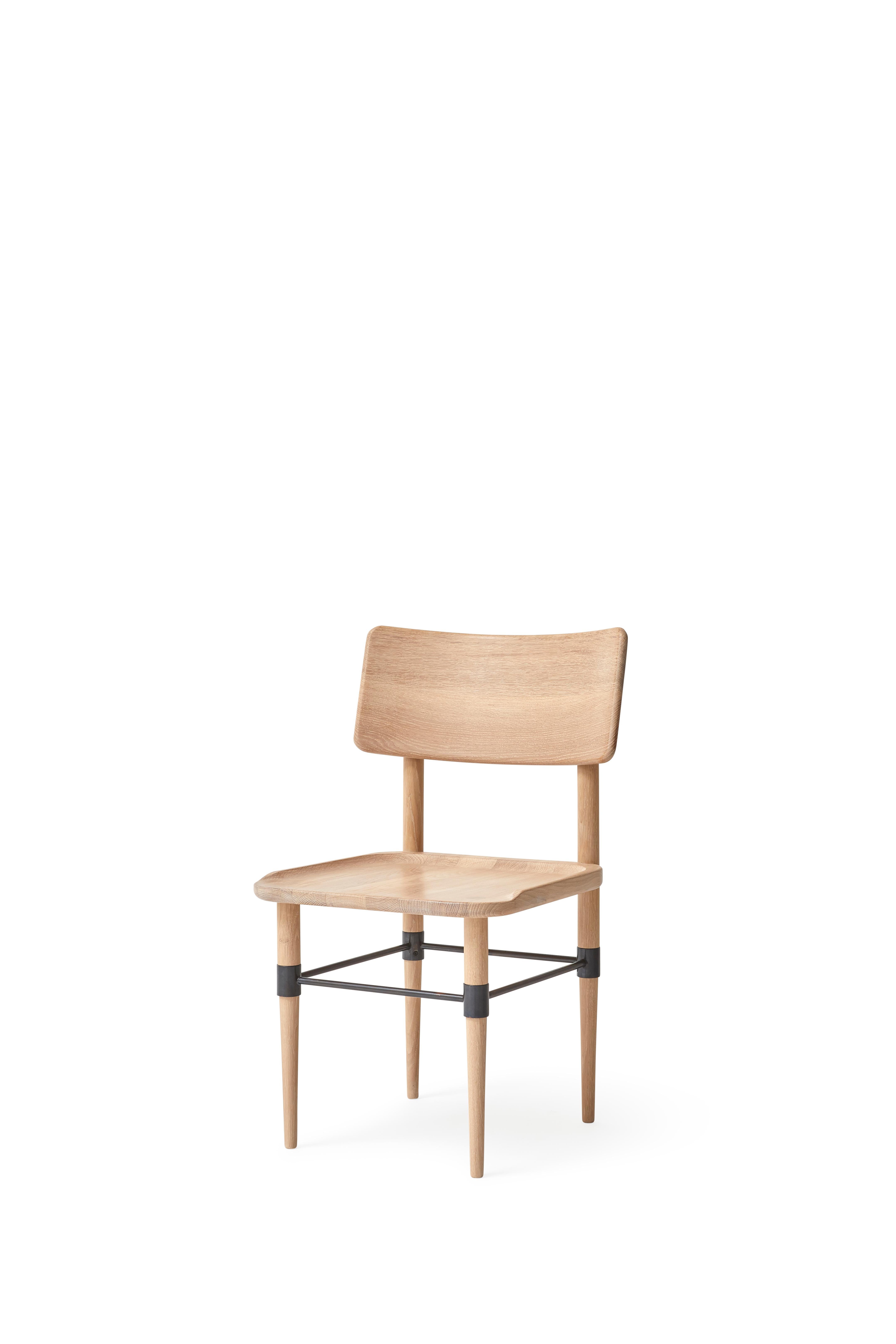 MG101 Dining chair in Light Nature oak and blackened metal. The seat pad is not included and can be ordered seperately.

The Holmen series originates in a series of furniture, which was developed for Michelin restaurant 108 in Copenhagen. The common