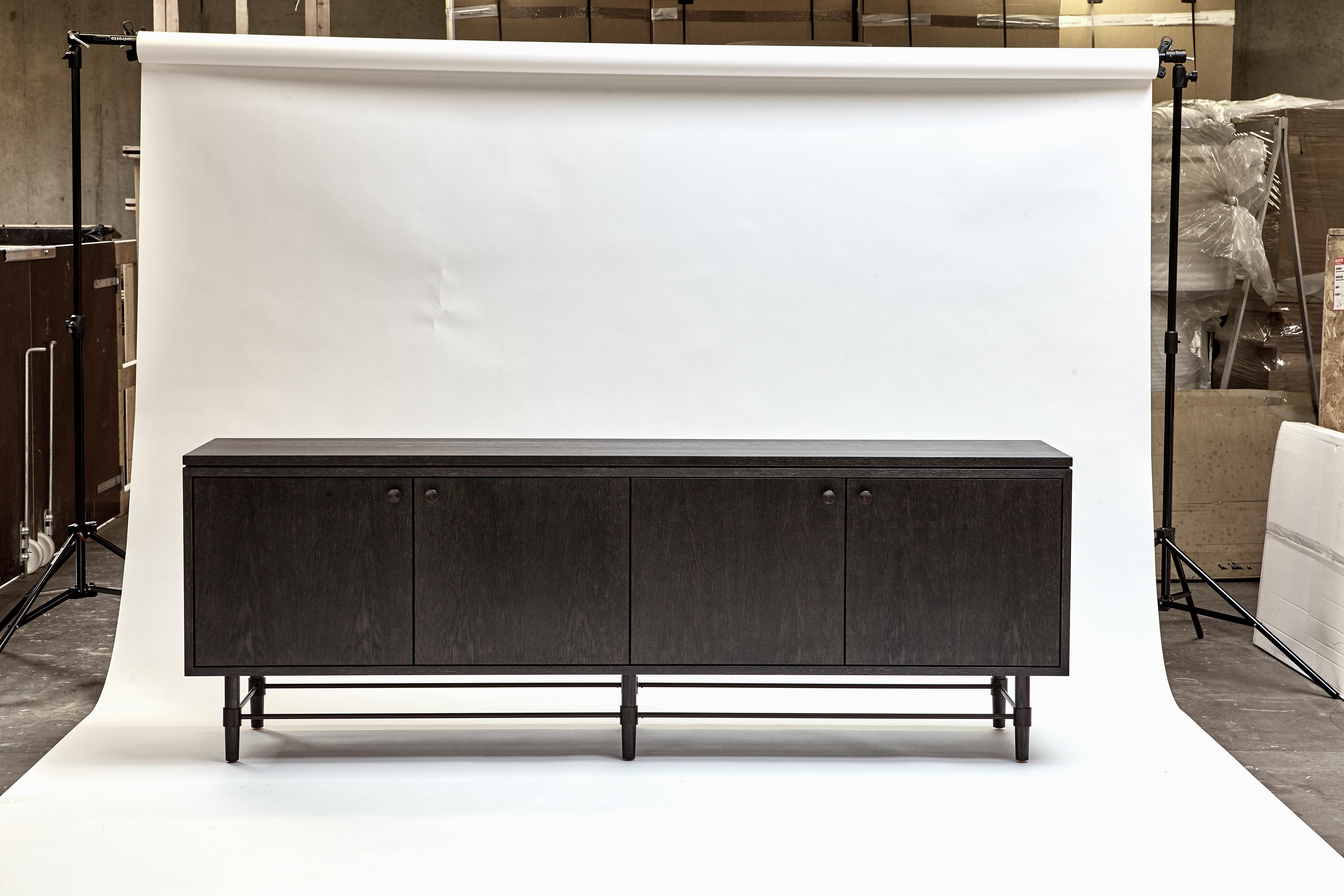 MG301 Credenza by Malte Gormsen
Dimensions: D 45 x W 200 x H 70.8 cm.
Materials: Dark Nature oak.

Available in Nature, Raw Nature, Light Nature, Grey Nature, and Dark Nature finishes.

Malte Gormsen Møbelsnedkeri is a cabinetmaker who combines