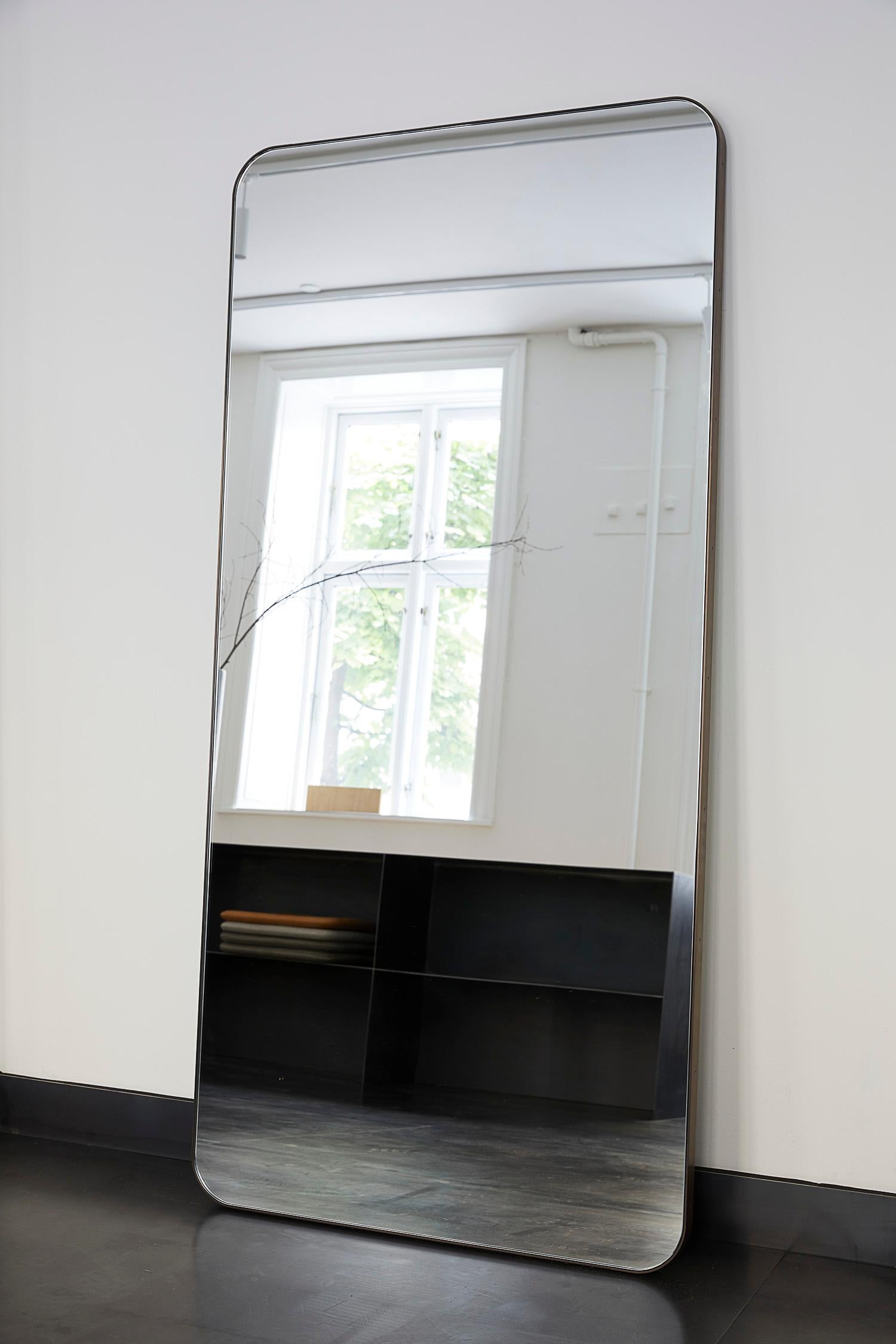 MG401 Large MIrror by Malte Gormsen
Dimensions: D 3 x W 80 x H 165 cm.
Materials: Browned brass.

Available in different dimensions. Please contact us.

Malte Gormsen Møbelsnedkeri is a cabinetmaker who combines Danish craftsmanship traditions with