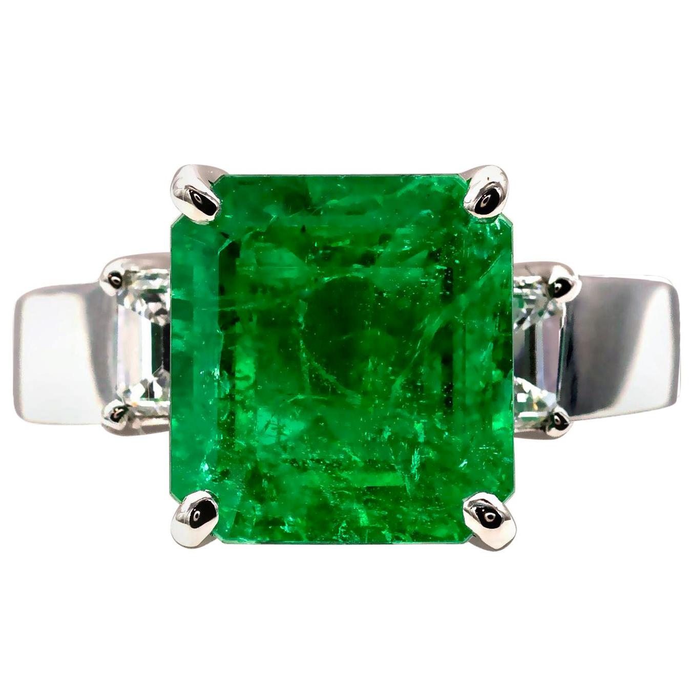 Certified 4.9 Carat Colombian Emerald and Diamond Three-Stone Ring