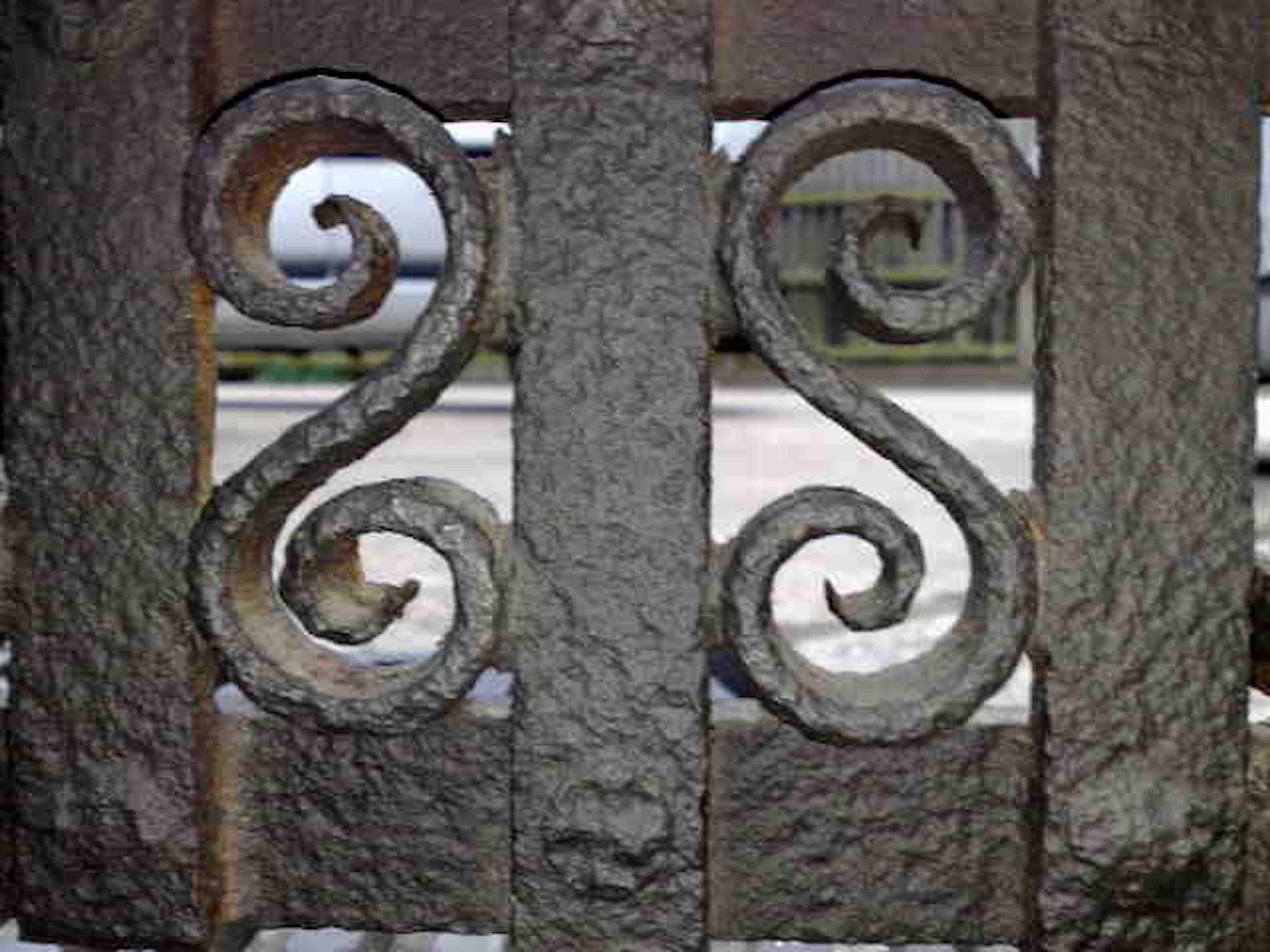 Cast M.H. Baillie Scott Attributed, a Hand Forged Iron Grate with Integrated Andirons For Sale