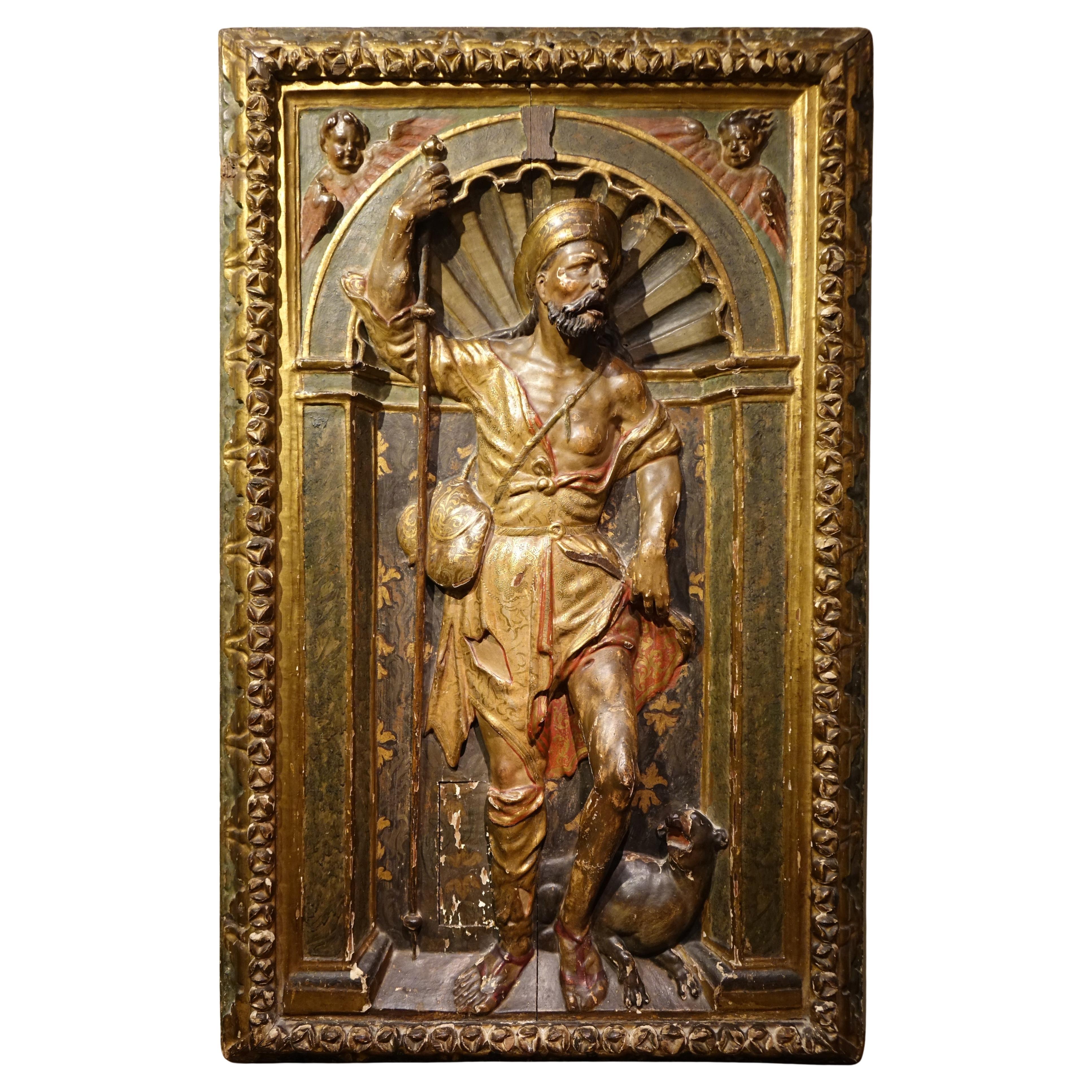 Mi-relief en bois doré et polychromé, représentant saint-Roch. Espagne , 16e S.