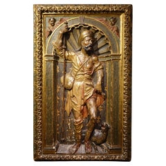 Mi-relief en bois doré et polychromé, représentant saint-Roch. Espagne, 16e S.
