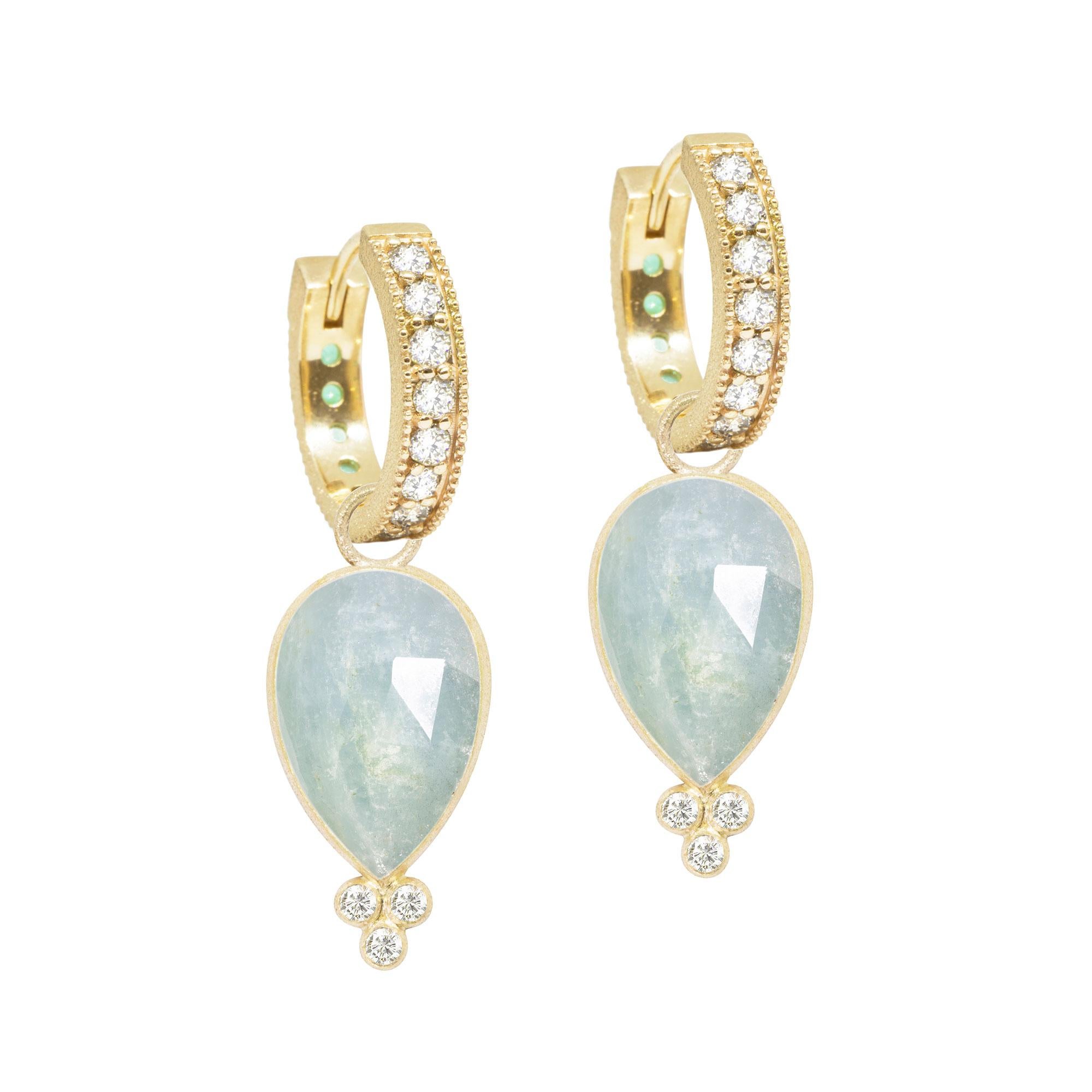 With rich, regal aquamarine in a petal-like pear shape, the diamond-accented Mia Small Gold Charms bloom with any of our hoops and mix well with other styles.


Nina Wynn Design's patent-pending earrings have an element on the back of the stud or
