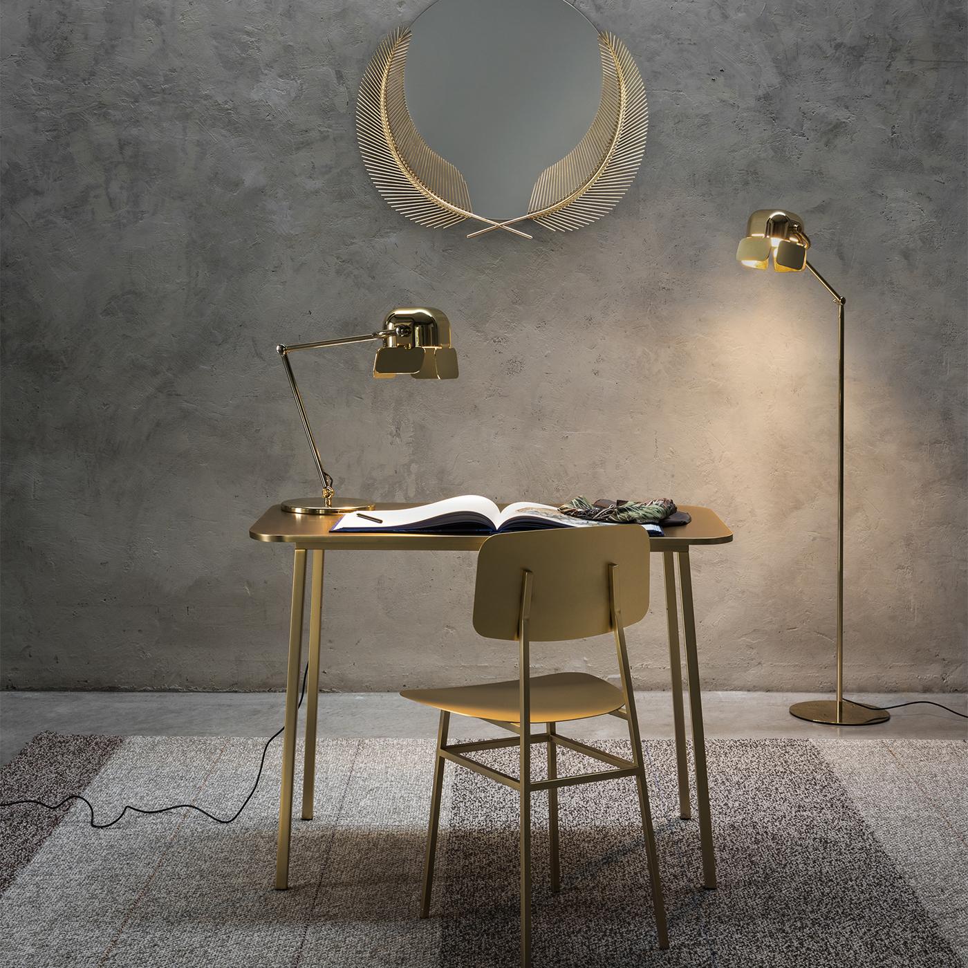 This elegant table designed by Nika Zupanc is in stainless steel and can be combined with the Miami Chair. Its minimalist lines are an harmonious combination of straight and curved elements. The PVD coating guarantees no change in color or corrosion