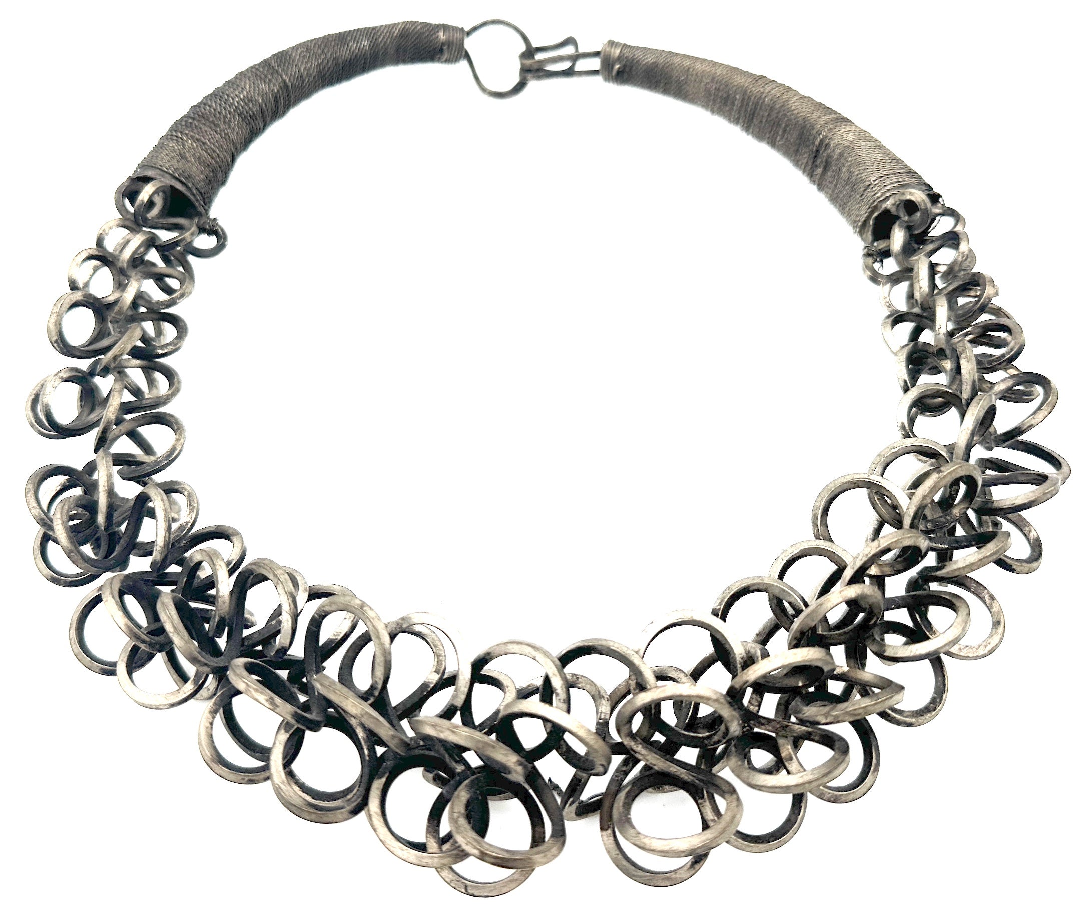 Miao Tribe Interlaced & Massed Rings Silver Pectoral Necklace
Miao Tribe, Northern Vietnam, Laos & Southwest China, Mid 20th Century  

An exquisite Miao Tribe Interlaced & Massed Rings Silver Pectoral Necklace, originating from Northern Vietnam,