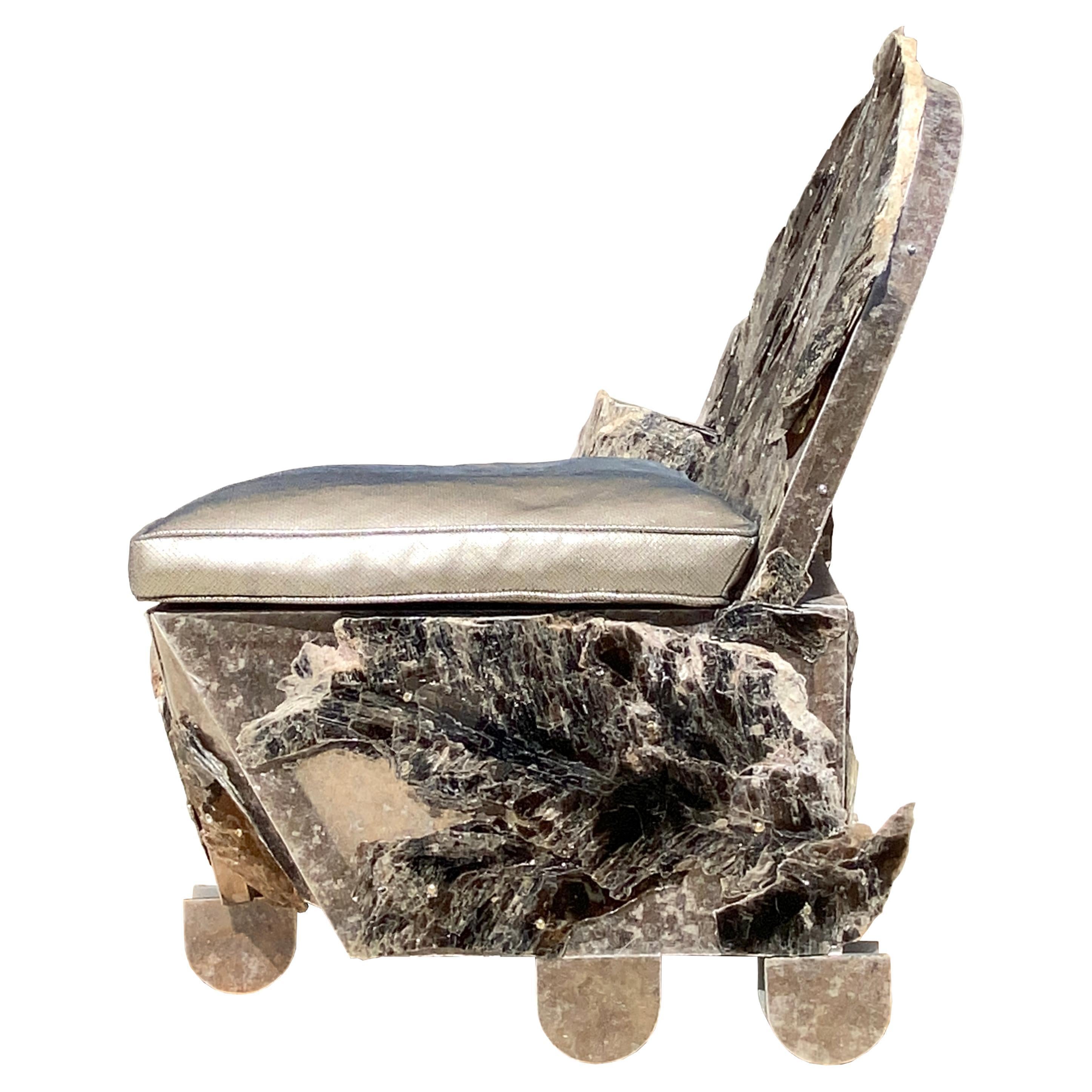 FOUND MINERALS SERIES (“MICA CHAIR”)
SCULPTURE
“Mica’s Chair” is a STEEL frame clad with sheets of opalized MICA and adorned with a metallic leather seat. Signed by the designer in a sense, the construction relies on a kind of design-through