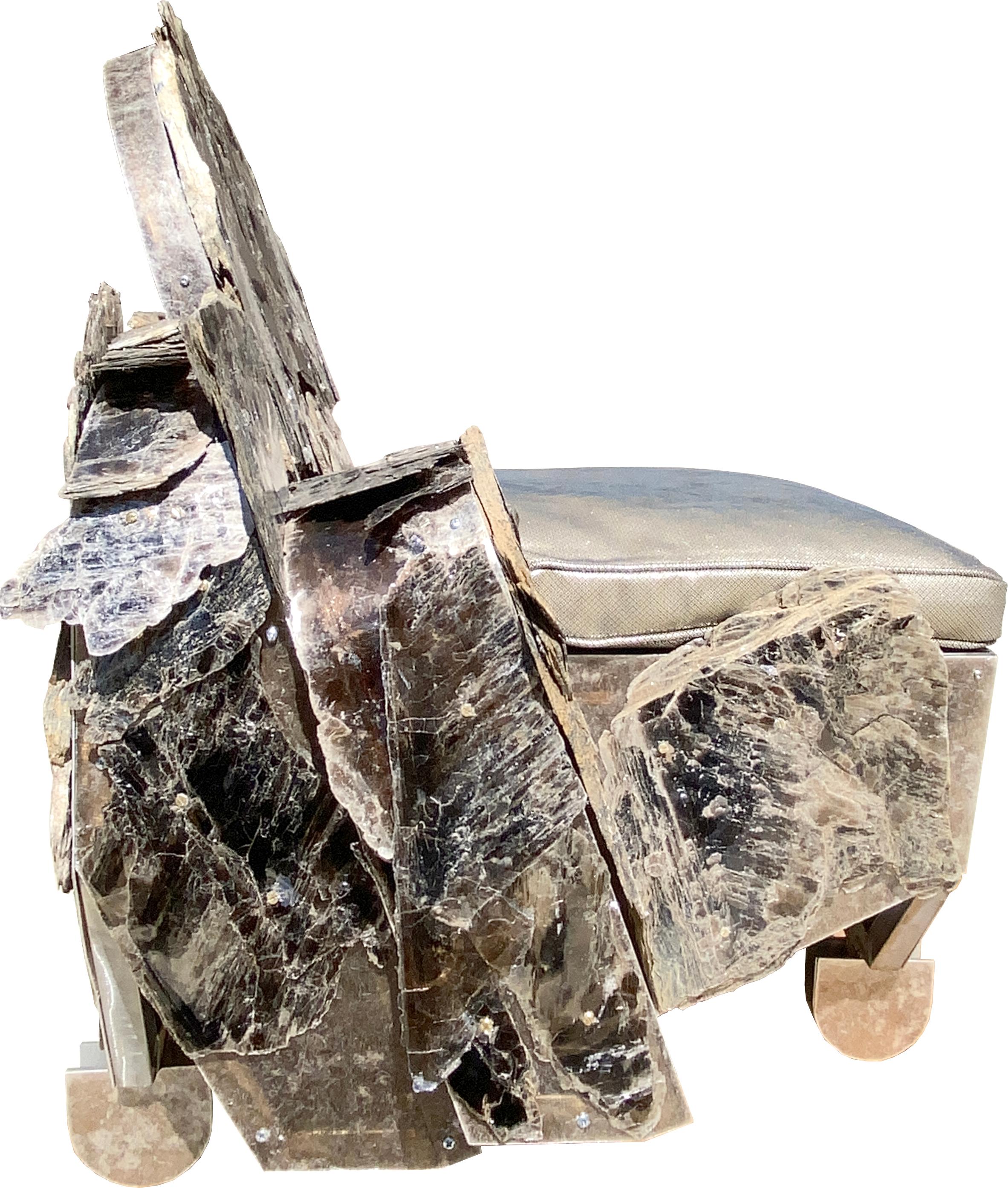 FOUND MINERALS SERIES (“MICA CHAIR”)
SCULPTURE
“Mica’s Chair” is a STEEL frame clad with sheets of opalized MICA and adorned with a metallic leather seat. Signed by the designer in a sense, the construction relies on a kind of design-through