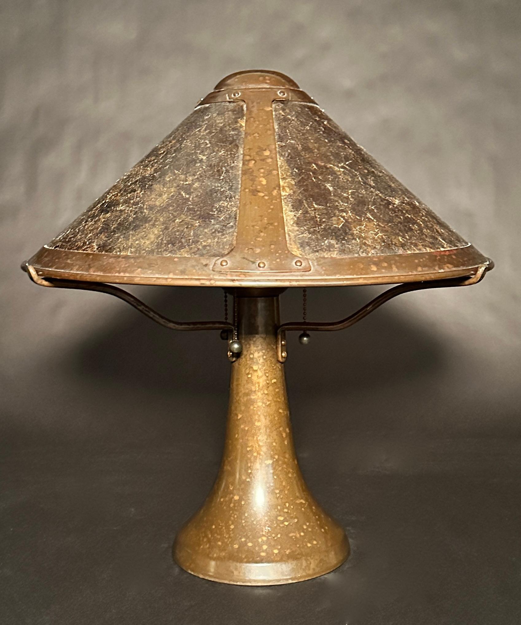 Copper and mica arts and crafts style lamp and shade made by the Mica Lamp Co., Glendale, Ca. base and shade with makers mark. Shade with serial number. Round base and shade with three interior lights.