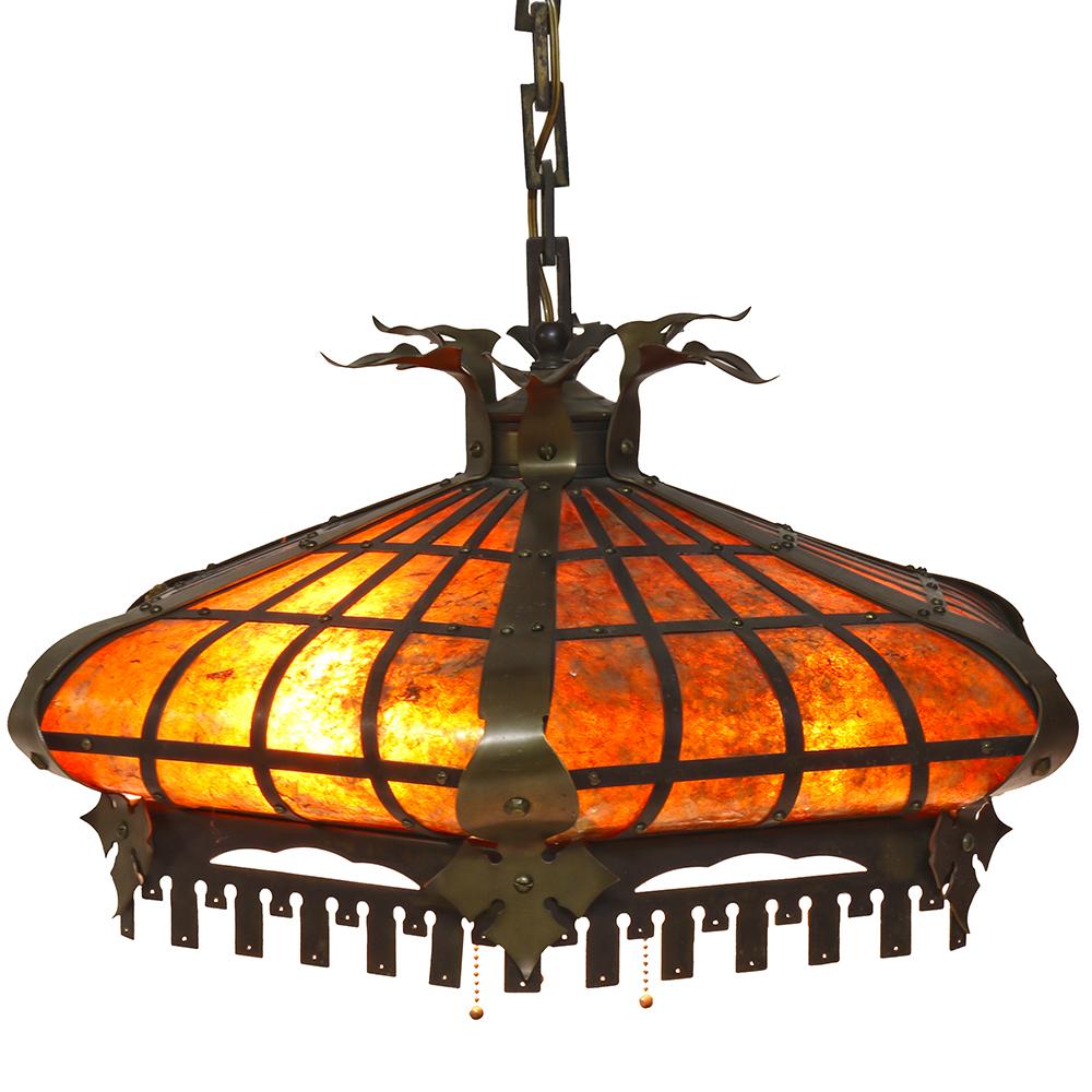 This beautiful Tudor Revival style pendant is the perfect pairing for a space in need of a fixture that exudes warmth and richness. The muted golden brass frame accents the mica shade and looks stunning when the light is on or off.