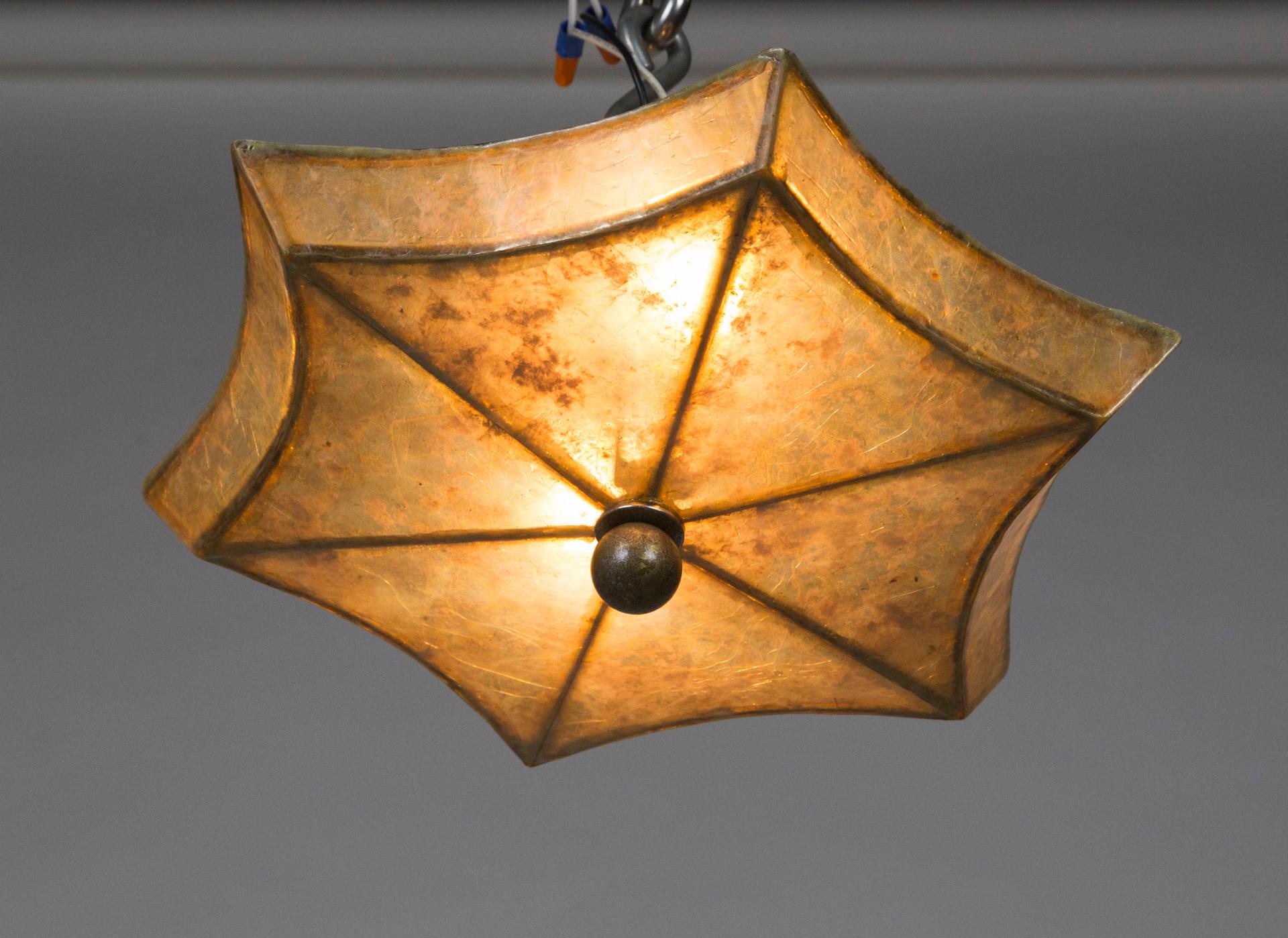 A star shaped, mica, semi flush mount light fixture. The mica has a complex textural look and tone, gorgeous both lit and unlit. 6.5