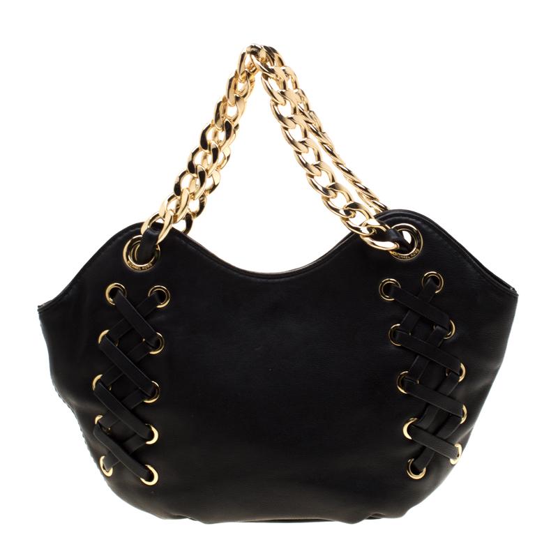 This chic bag in black is from Michael Michael Kors. The bag is crafted from leather and features lace-up accents and a fabric-lined interior sized to fit your daily essentials. The bag is equipped with chain handles for you to swing it.

Includes: