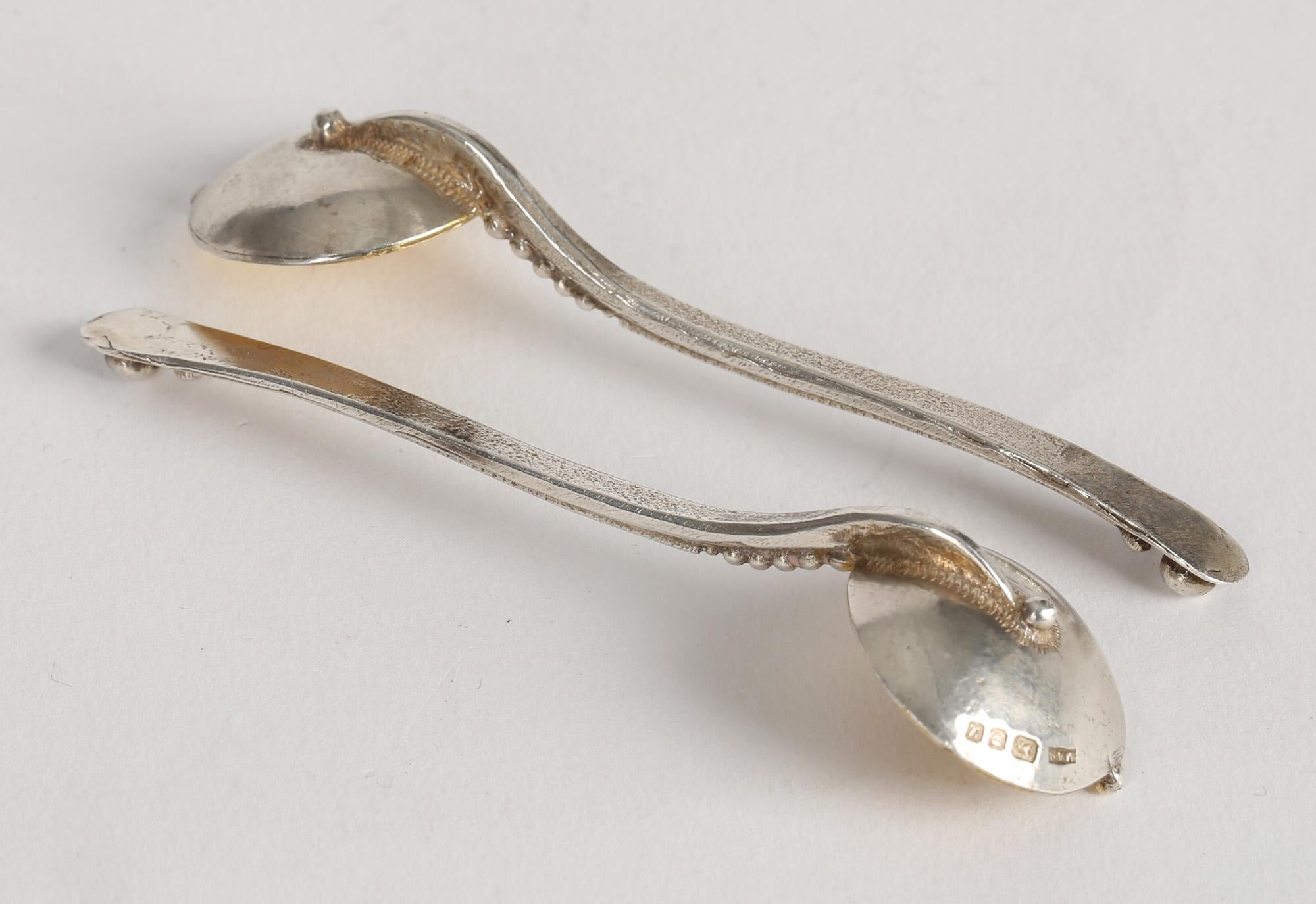 A stunning pair Arts & Crafts inspired gilded silver salt spoons by London silversmith Michael Allen Bolton dated 1994. Michael was an informally trained professional silversmith whose designs were inspired by ancient and medieval styles and the