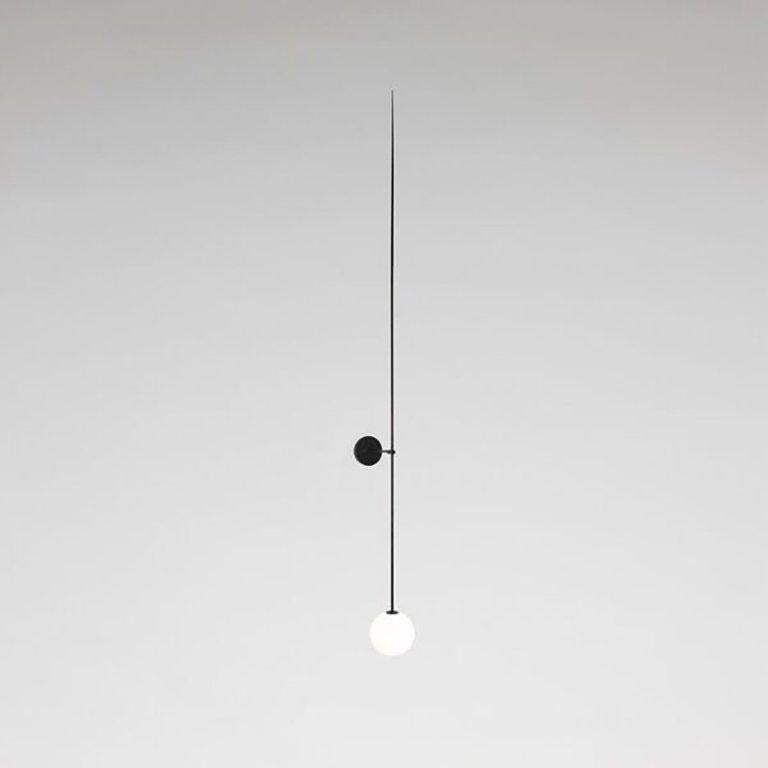 Mobile chandelier 10
Manufactured by Michael Anastassiades
London, 2015
Black patinated brass, mouth blown opaline spheres

Measurements:
15 cm x 193 H cm
5,9 in x 76h in

Concept
The studio’s philosophy is a continuous search for