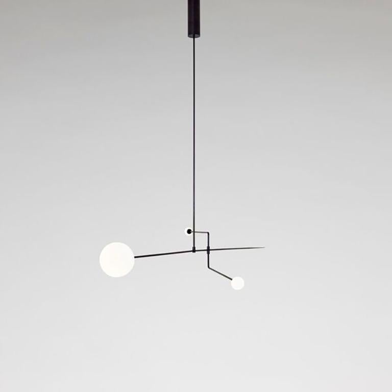 Mobile Chandelier 3
Manufactured by Michael Anastassiades
London, 2008
Black patinated brass, mouth blown opaline spheres

Measurements
239 cm + Pendant rod length to order
94.09 in + Pendant rod length to order

Concept:
The studio’s