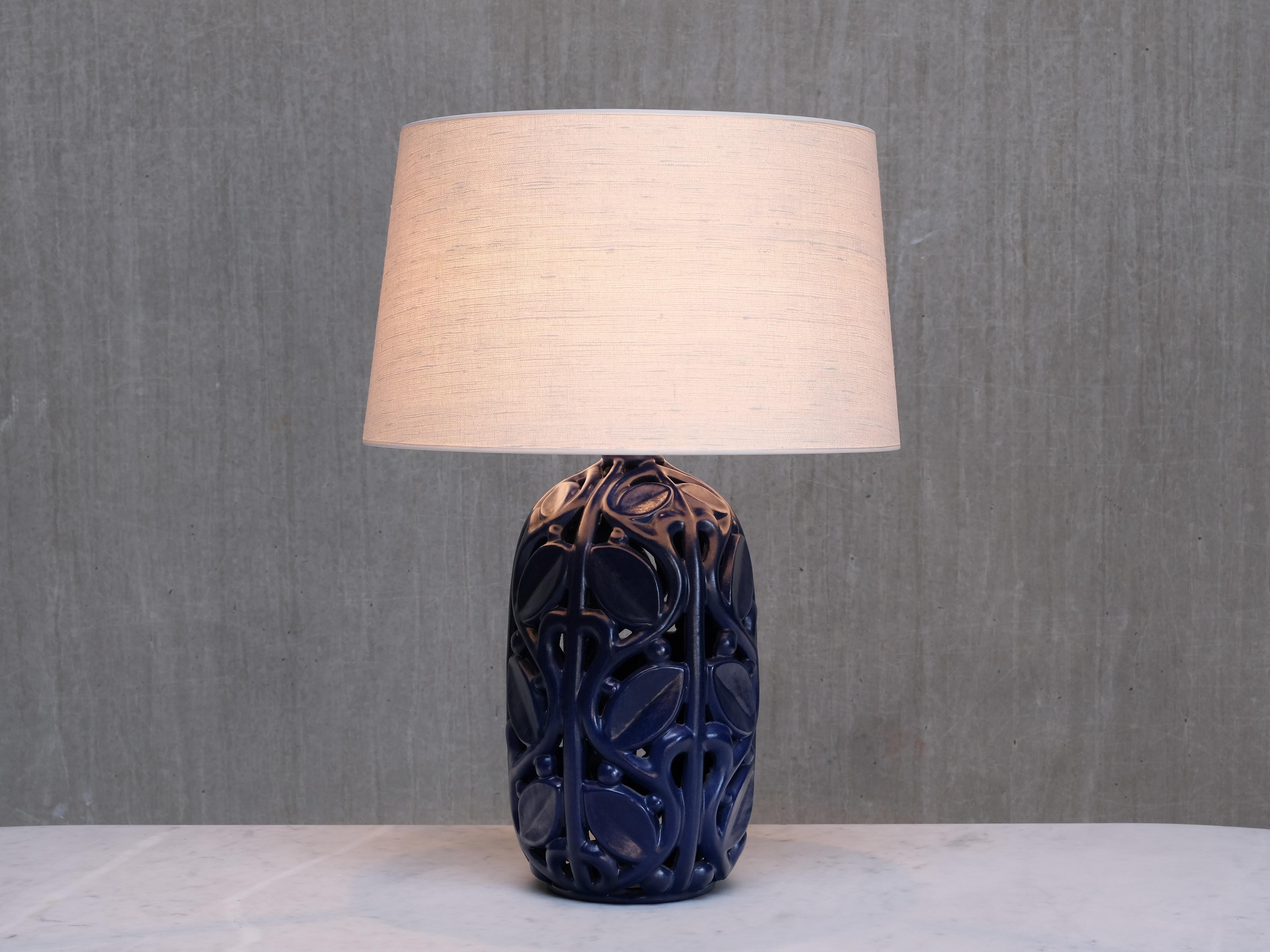 This table lamp was produced by Michael Andersen & Søn in Bornholm, Denmark, in the 1940s. Few examples of this model are known, and it is exceptionally rare to find one in this distinctive blue glaze. The lamp bears the manufacturer’s label on the
