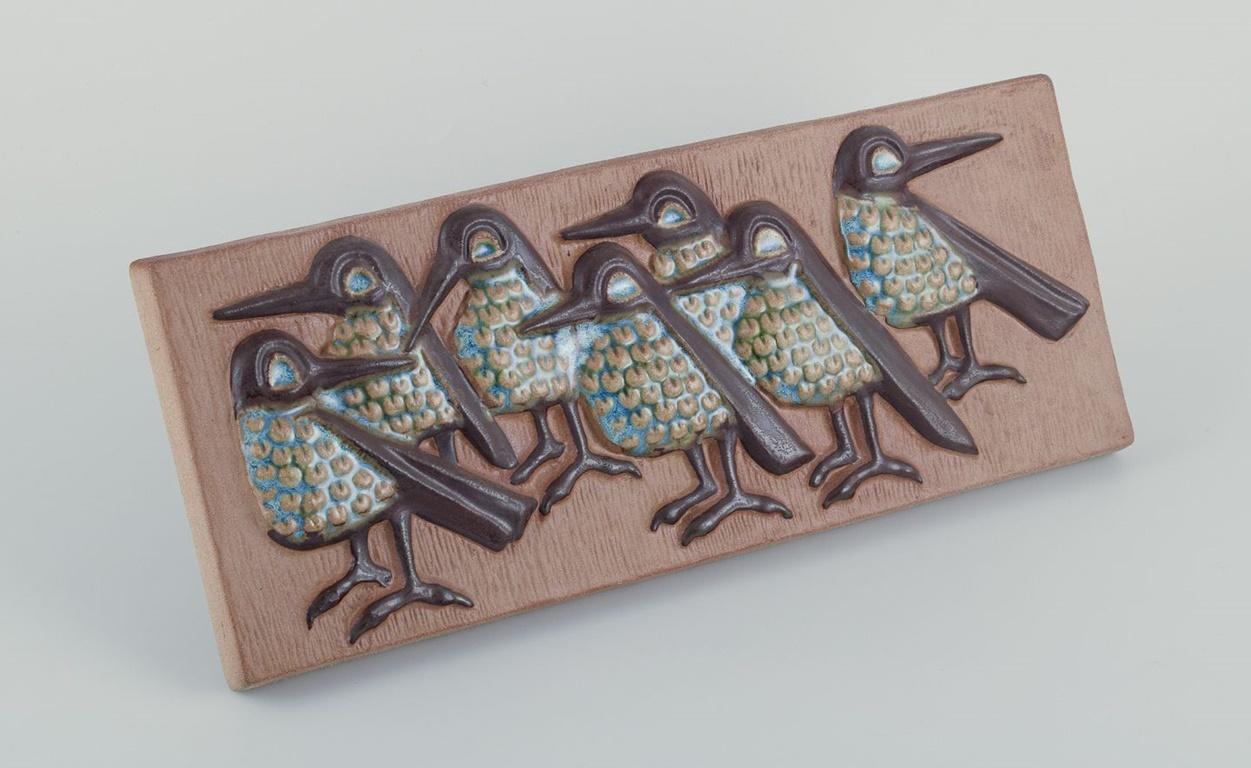 Pre-owned goods are exempt from import duties for U.S. customers. 
Therefore, no import tariffs will be applicable to your purchase.

Michael Andersen, Bornholm.
Elongated ceramic wall plaque. Birds in relief. Hand-glazed.
Dating: Ca.