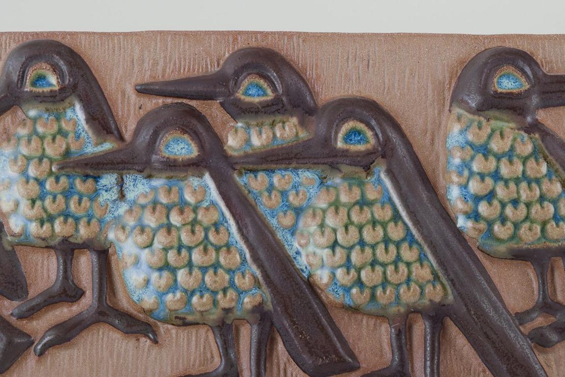 Danish Michael Andersen, Bornholm. Elongated ceramic wall plaque. Birds in relief. For Sale