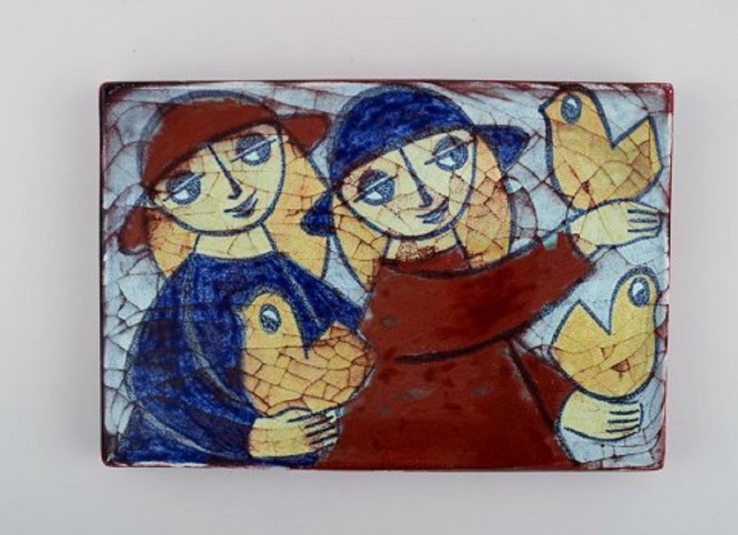 Michael Andersen, Bornholm. Wall plaque and two bowls in glazed ceramics with young girls and birds. Beautiful crackled glaze. 1950s.
Largest measures: 22 x 15 cm.
In excellent condition.
Stamped.