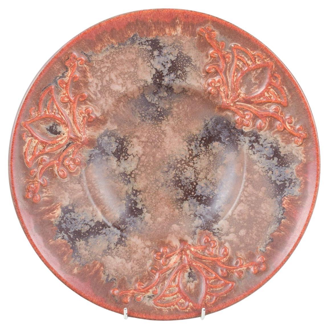 Michael Andersen, Denmark. Large stoneware dish decorated with relief pattern.