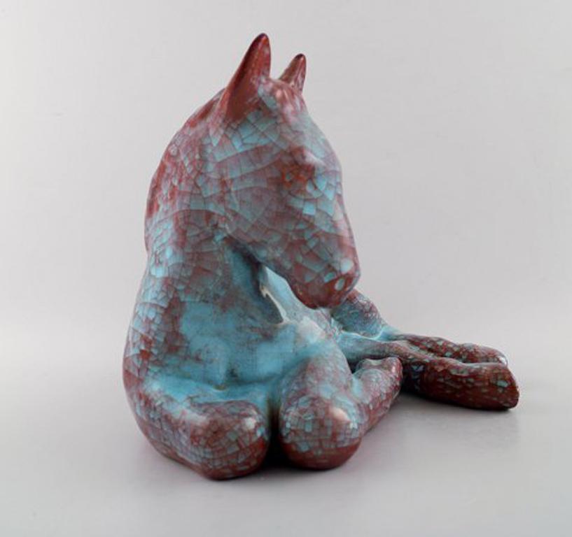 Michael Andersen: Lying foal / horse in green and violet glaze.
Measures: 27 x 18 cm.
In perfect condition.
Marked.